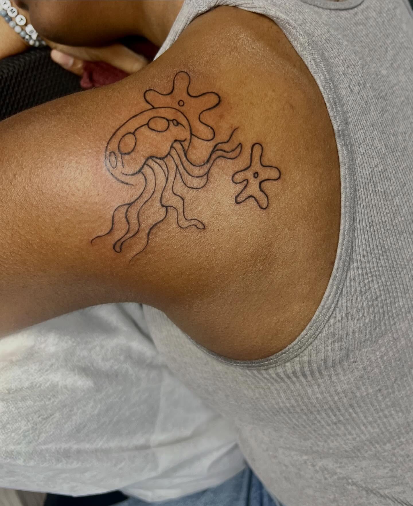 Octopus and starfish black and grey tattoo on the shoulder by Haiiitattoo
