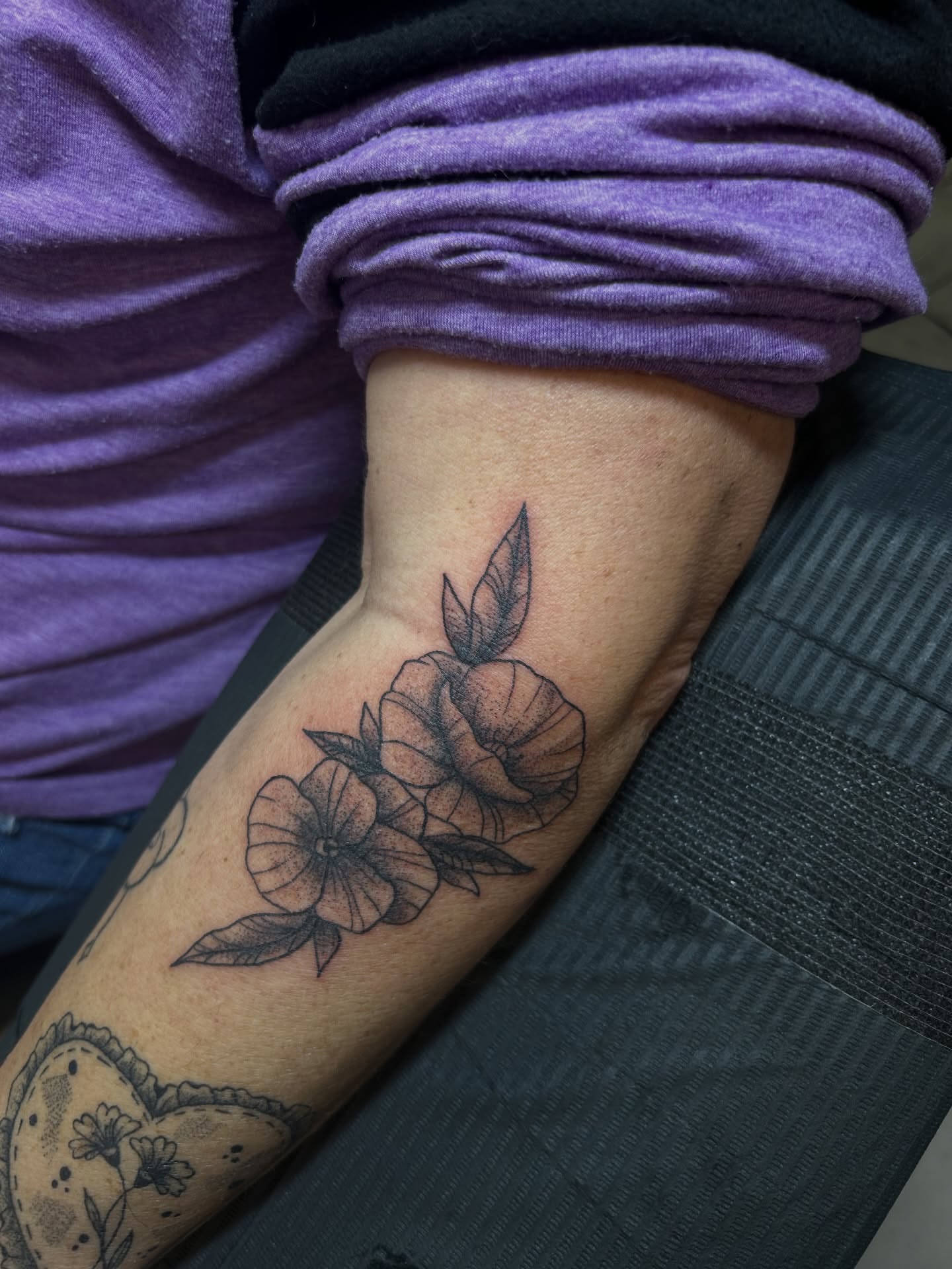 Flowers black and grey tattoo on the forearm by Torrey, Austin, Texas