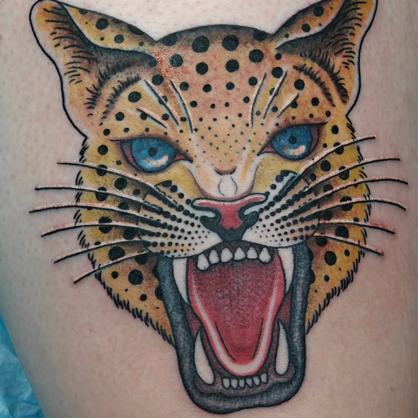 Leopard dotwork tattoo on the thigh by Tattoos by Reed Blount