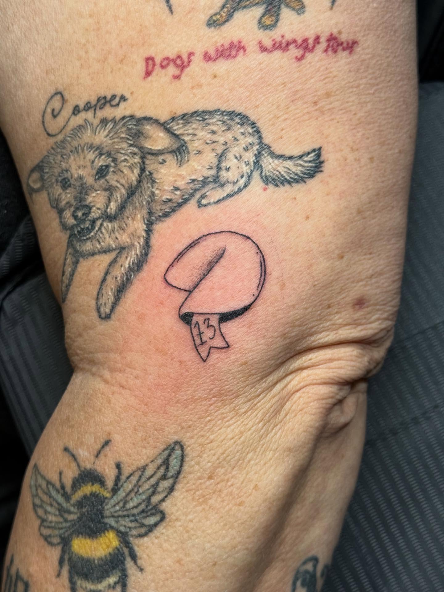 Dog and fortune cookie black and grey tattoo on the forearm by Max