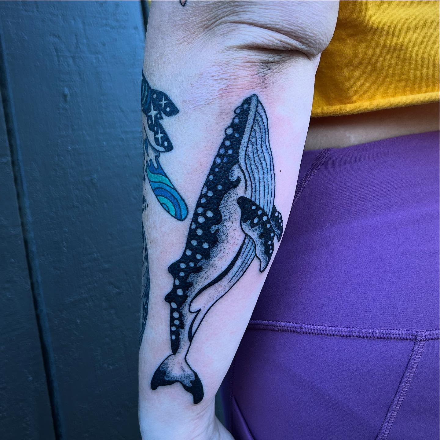 Whale dotwork tattoo on the forearm by Erica Finley