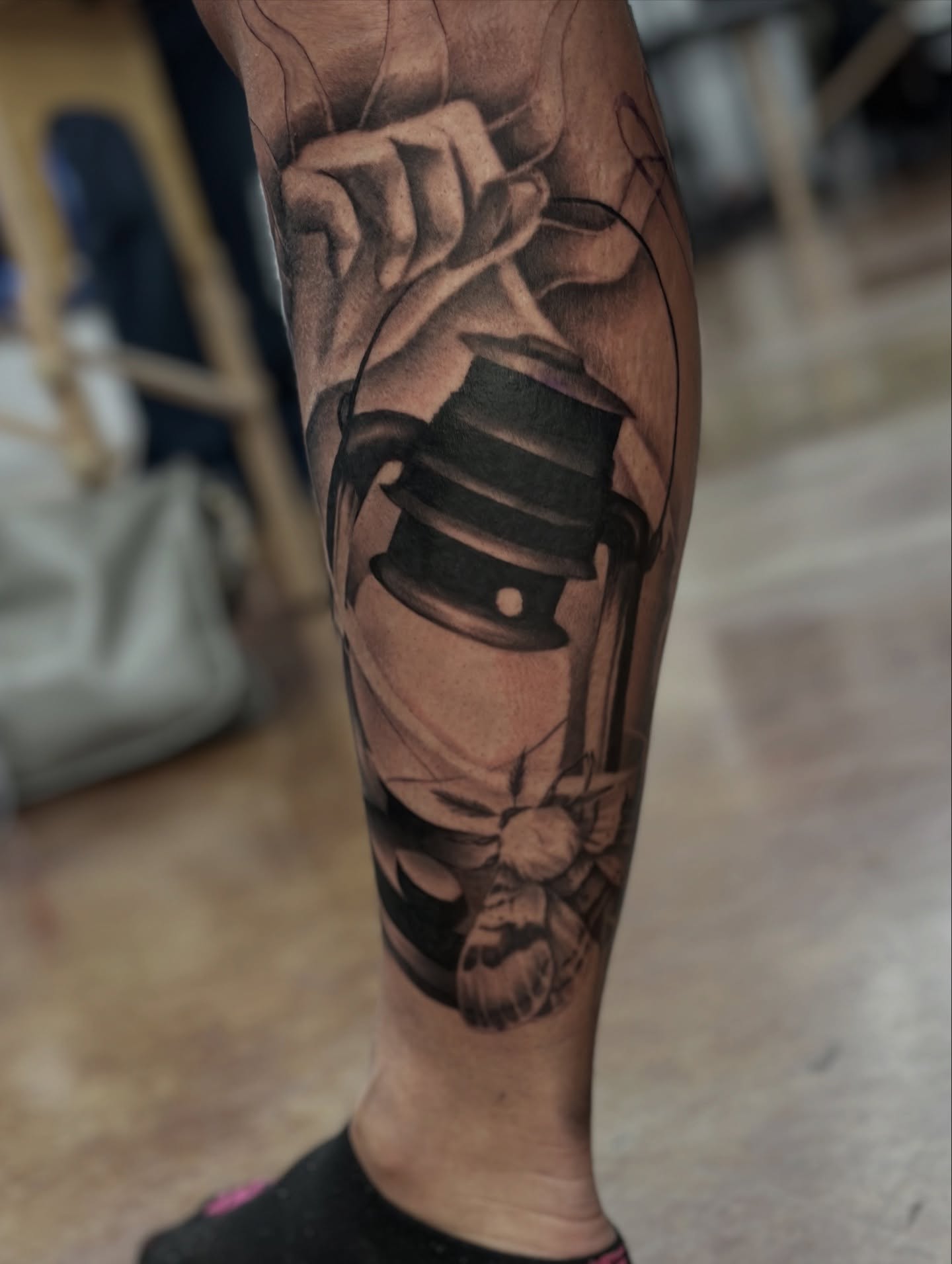 Top hat and skull realism tattoo on the forearm by Trent Hebert