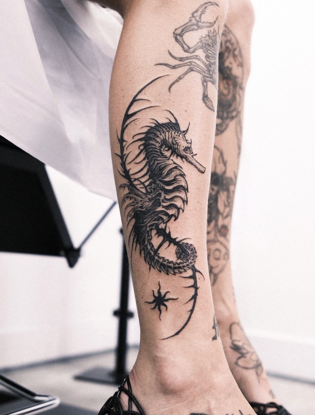 Seahorse black and grey tattoo on the calf by 우레