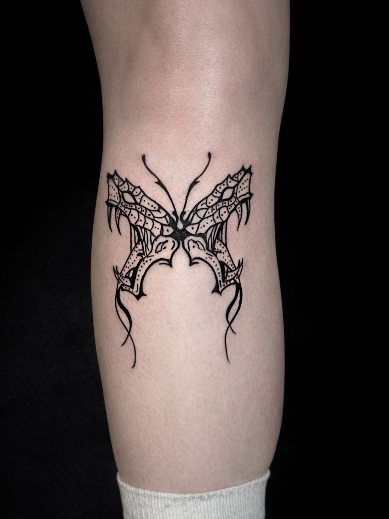 Butterfly geometric tattoo on the forearm by Salvador Mendoza, Sesto San Giovanni