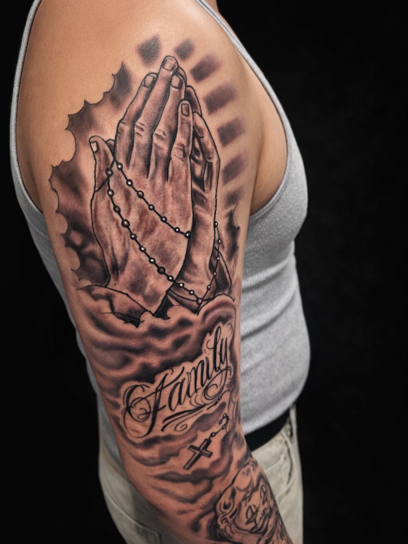 Praying hands realism tattoo on the forearm by Salvador Mendoza, Sesto San Giovanni