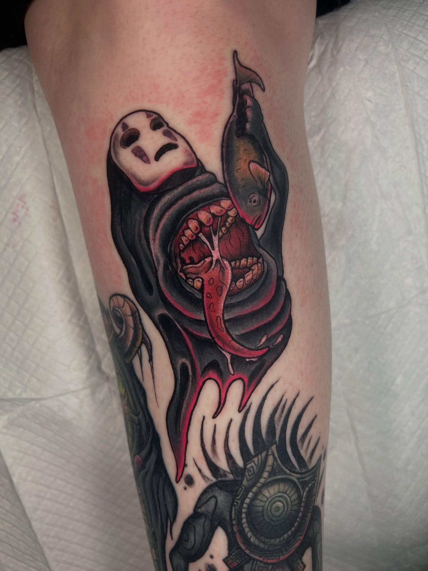 Woman with fish dark realism tattoo on the forearm by Brandon Durbin