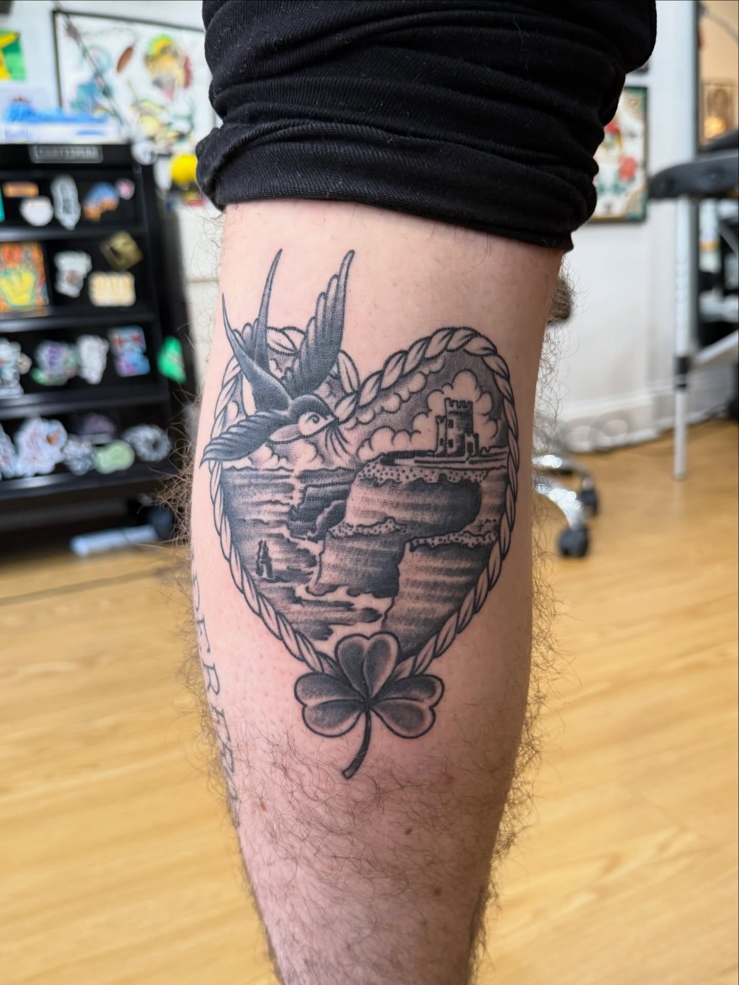 Heart with coastal scene black and grey tattoo on the forearm by Matt Kearney
