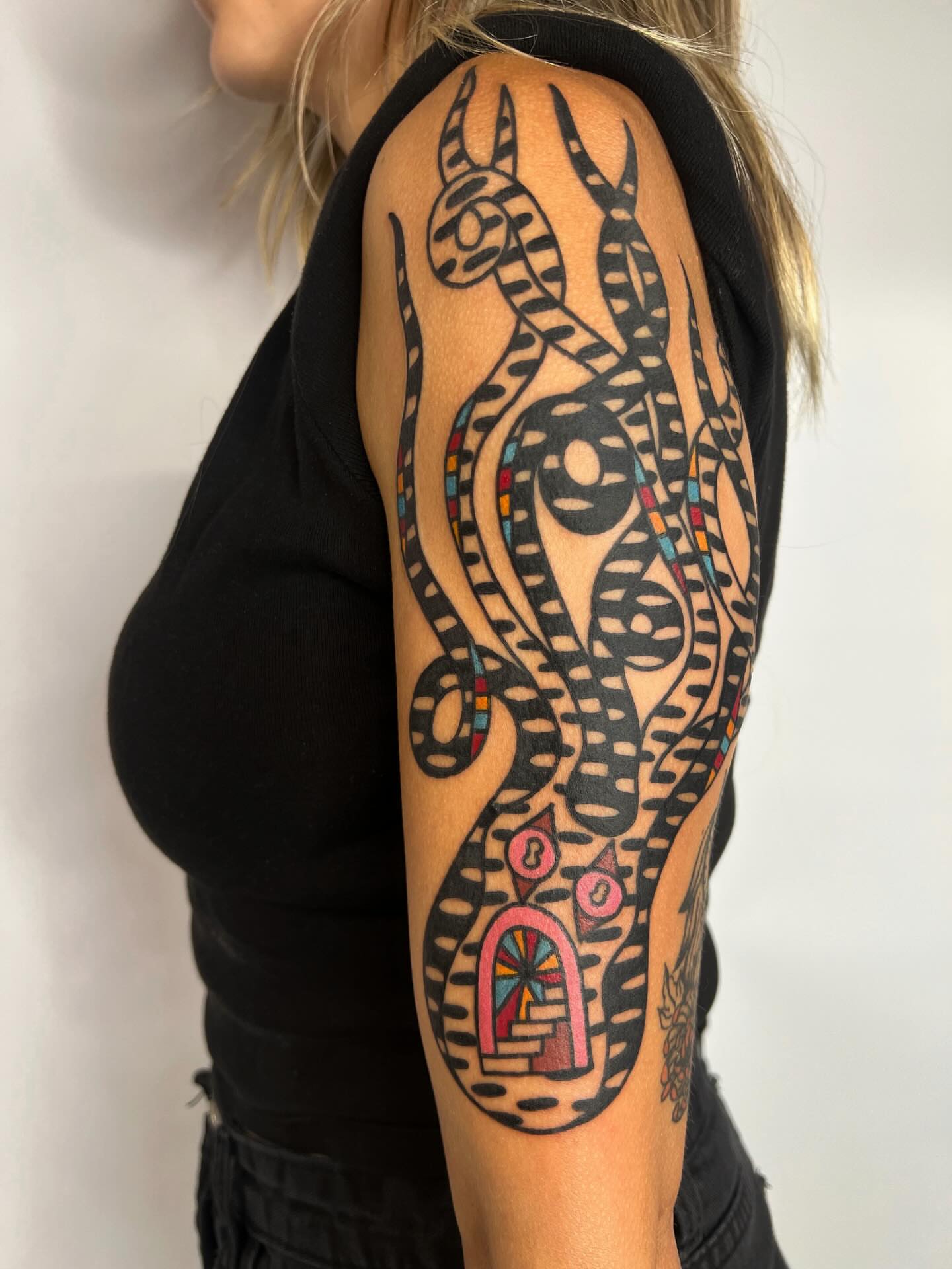 Octopus tribal tattoo on the forearm by Manee Friday