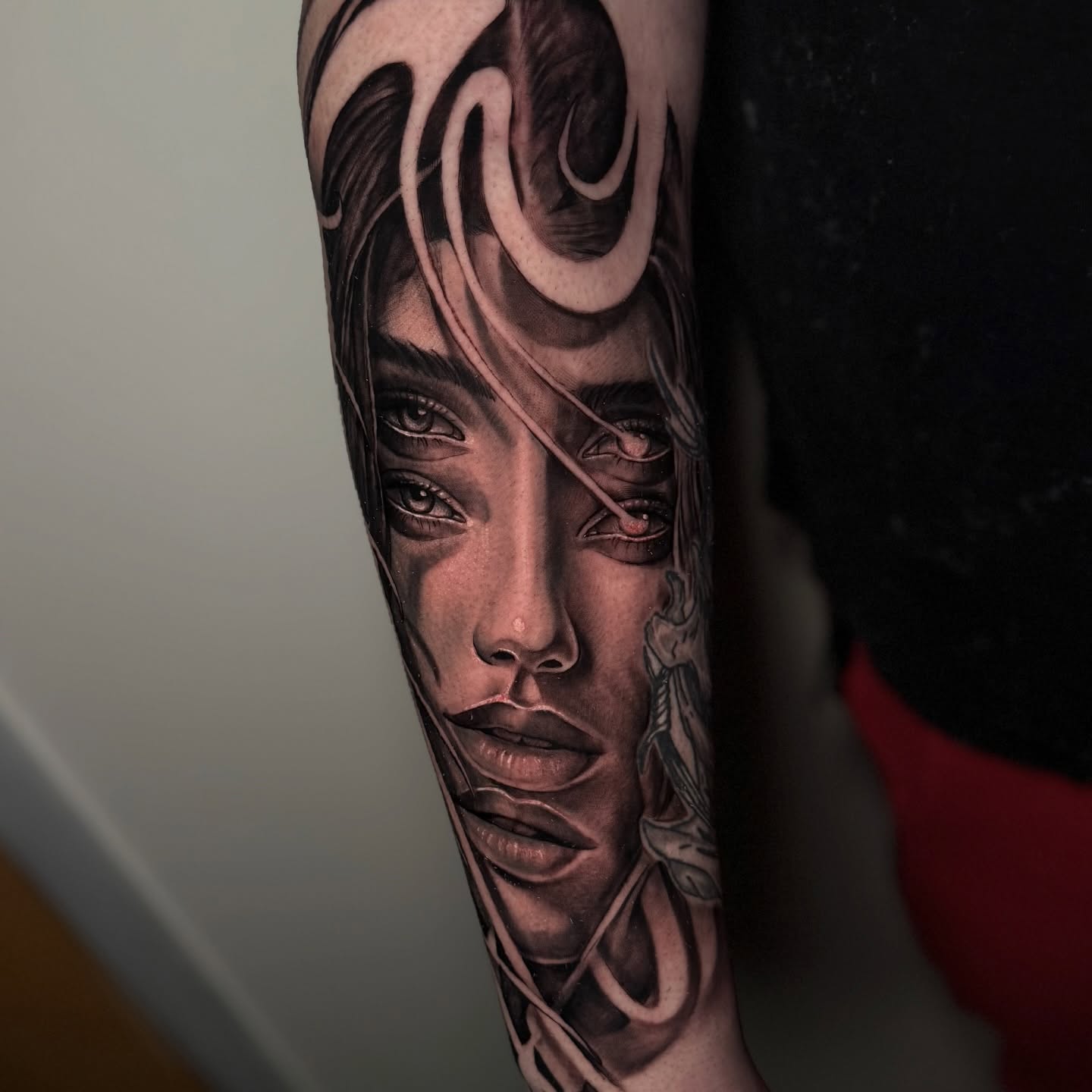 Woman's face realism tattoo on the forearm by Indiana Tattoo Artist