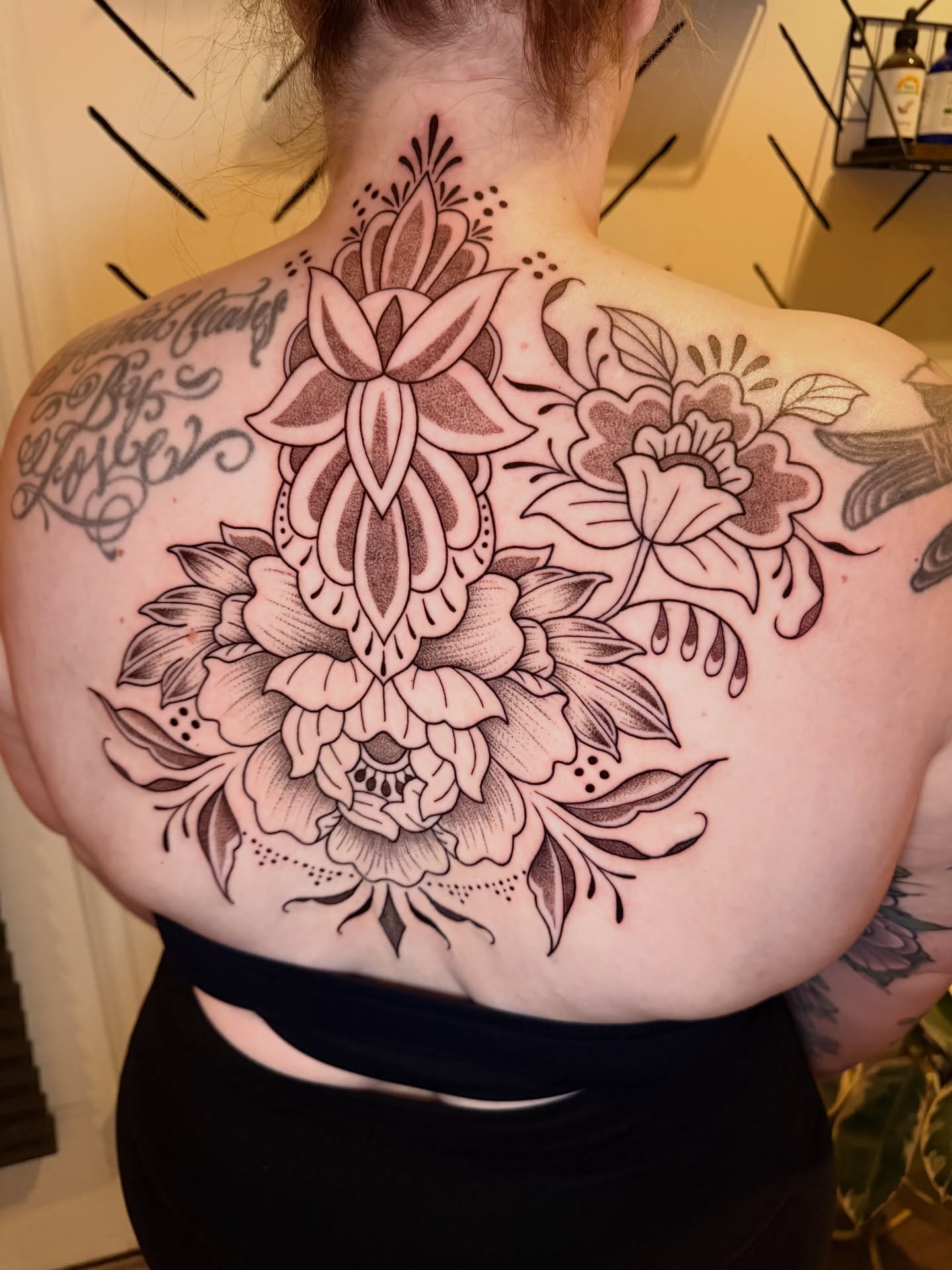 Floral arrangement ornamental tattoo on the back by ππ£ππ€π₯π ππ¦ππ‘π, Lakewood, Colorado
