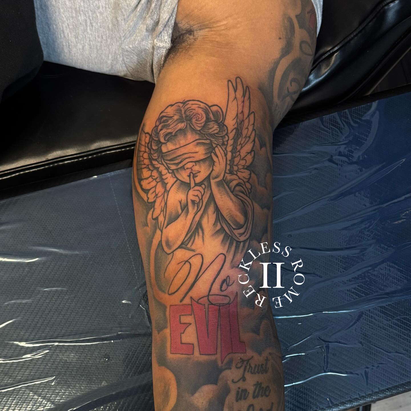 Angel with blindfold neo-traditional tattoo on the forearm by Rome