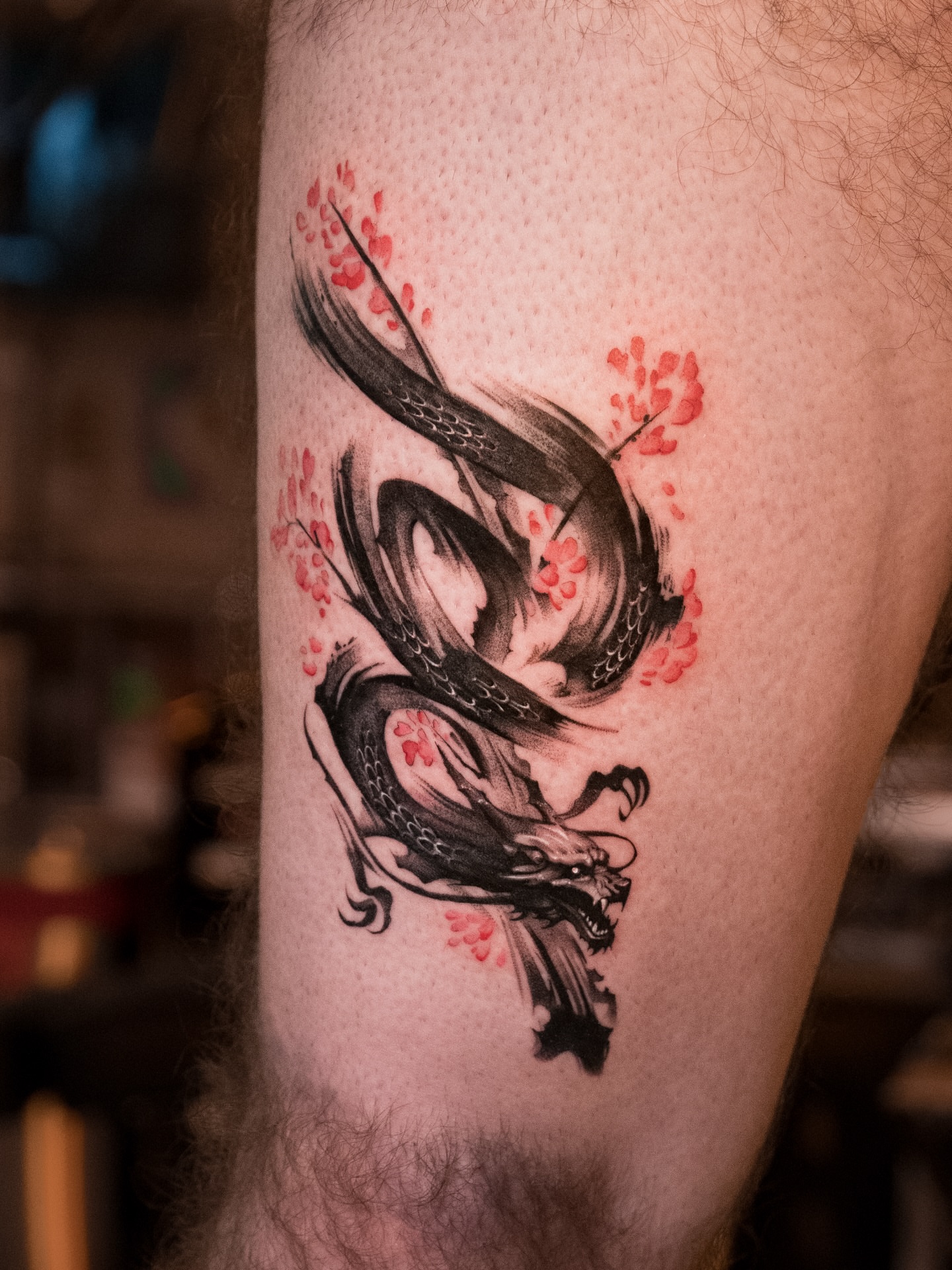 Dragon and blossoms japanese irezumi tattoo on the forearm by Mateo