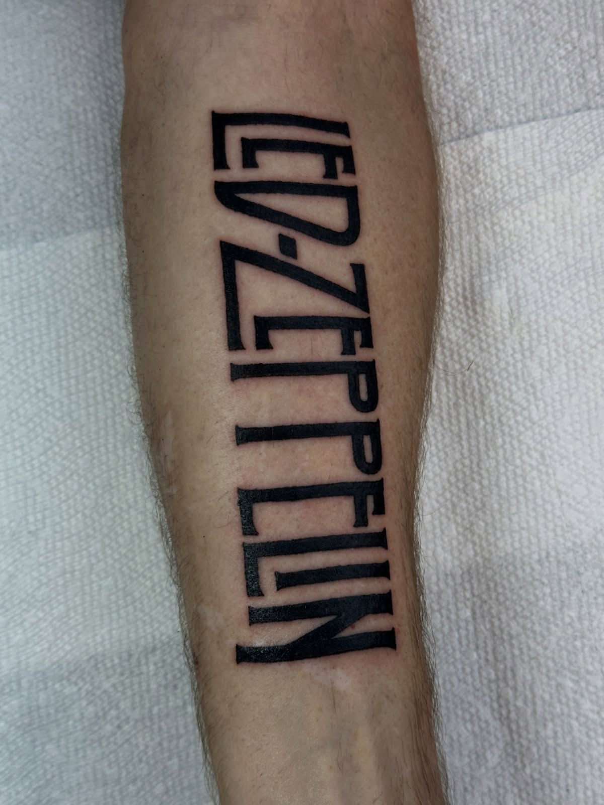 LED-ZEPPELIN lettering script tattoo on the forearm by Gabriel F Kingston Beitia