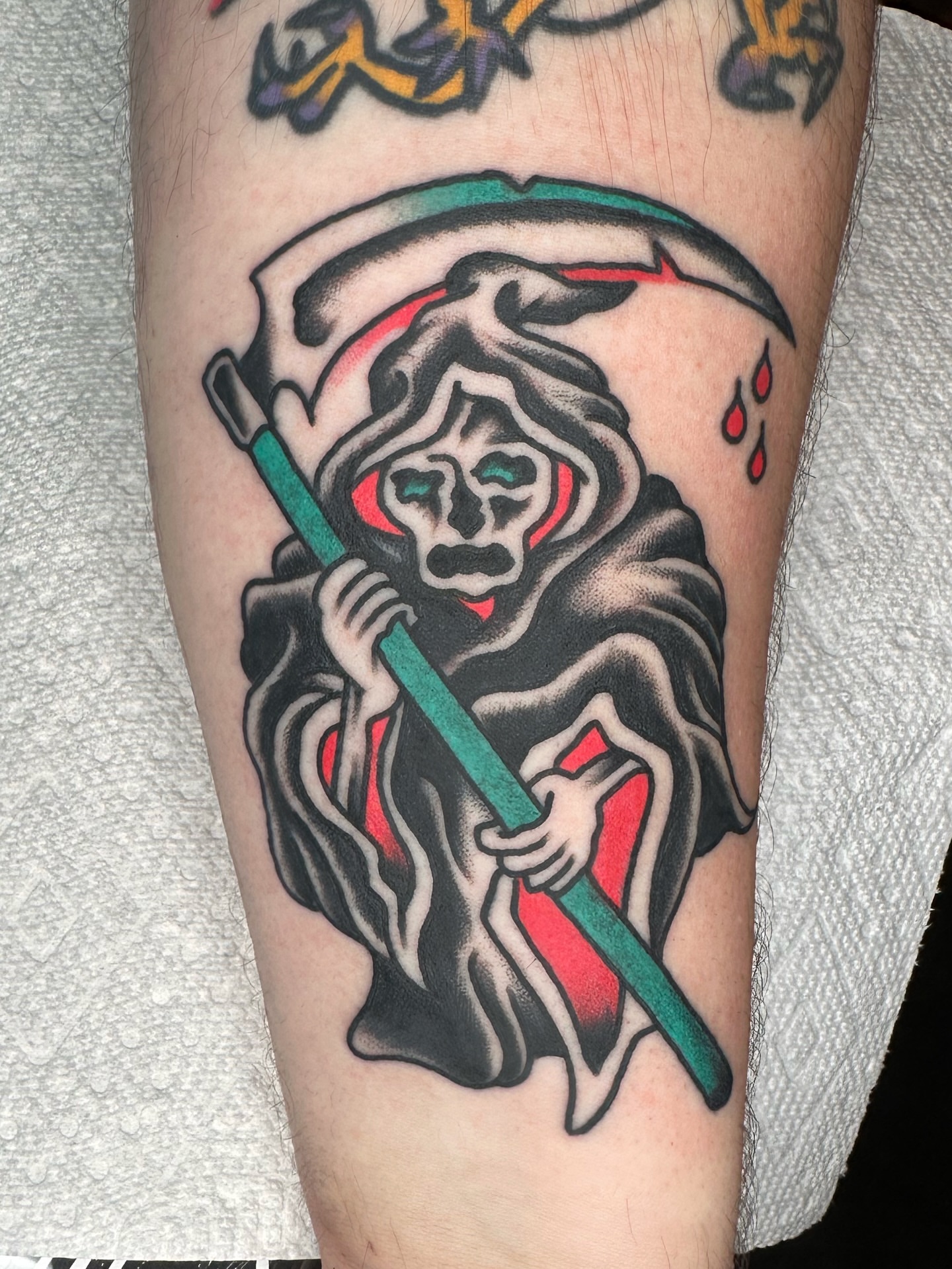 Grim reaper American traditional tattoo on the forearm by Brock Johnson