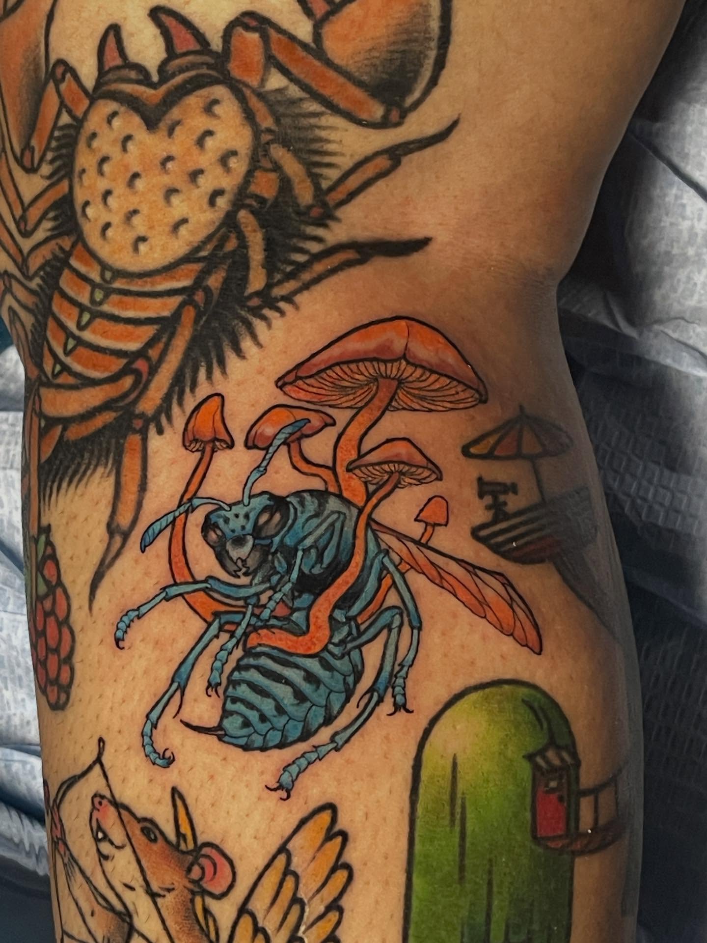 Insects and mushrooms American traditional tattoo on the thigh by Joe Moreira