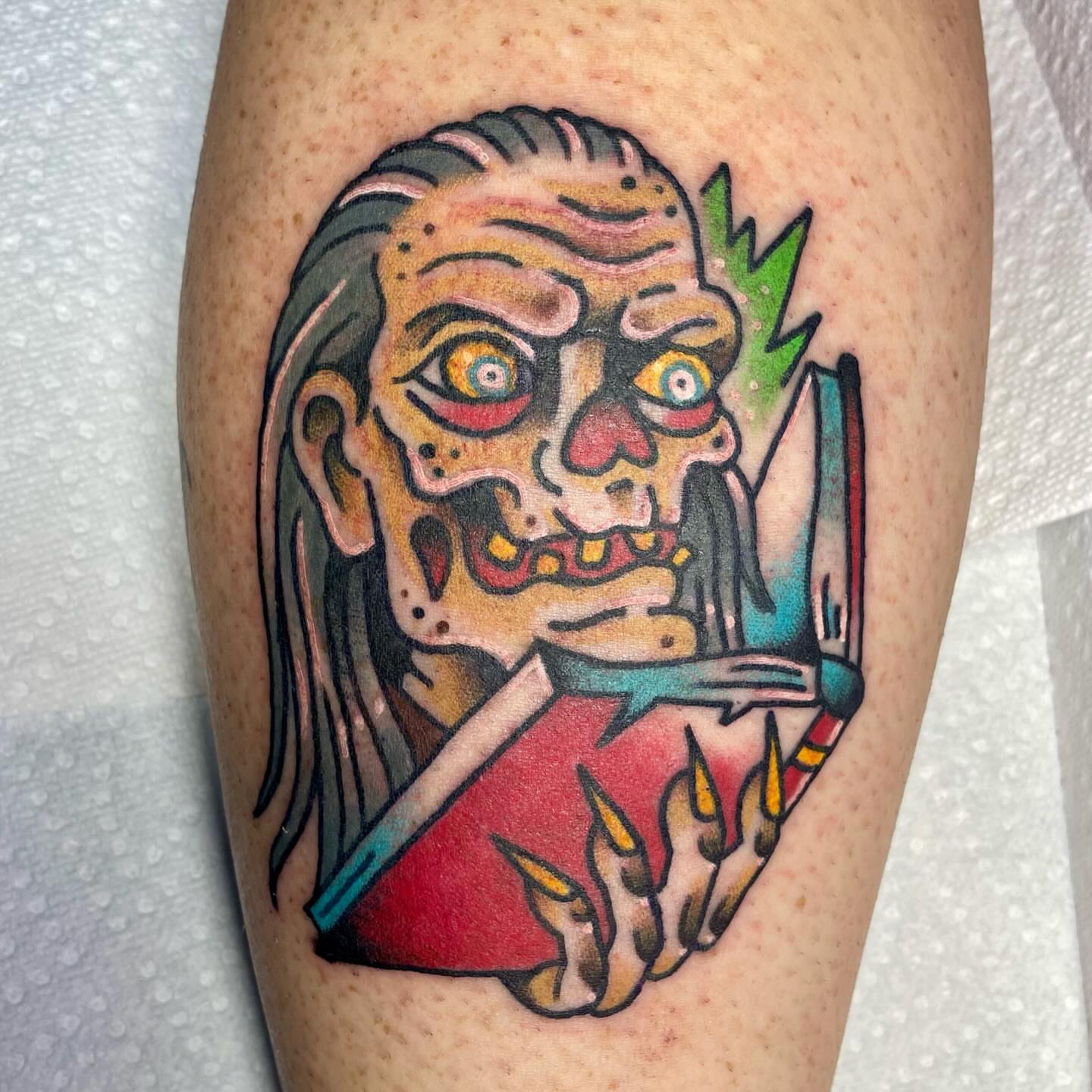Zombie head American traditional tattoo on the thigh by Robert Morrow