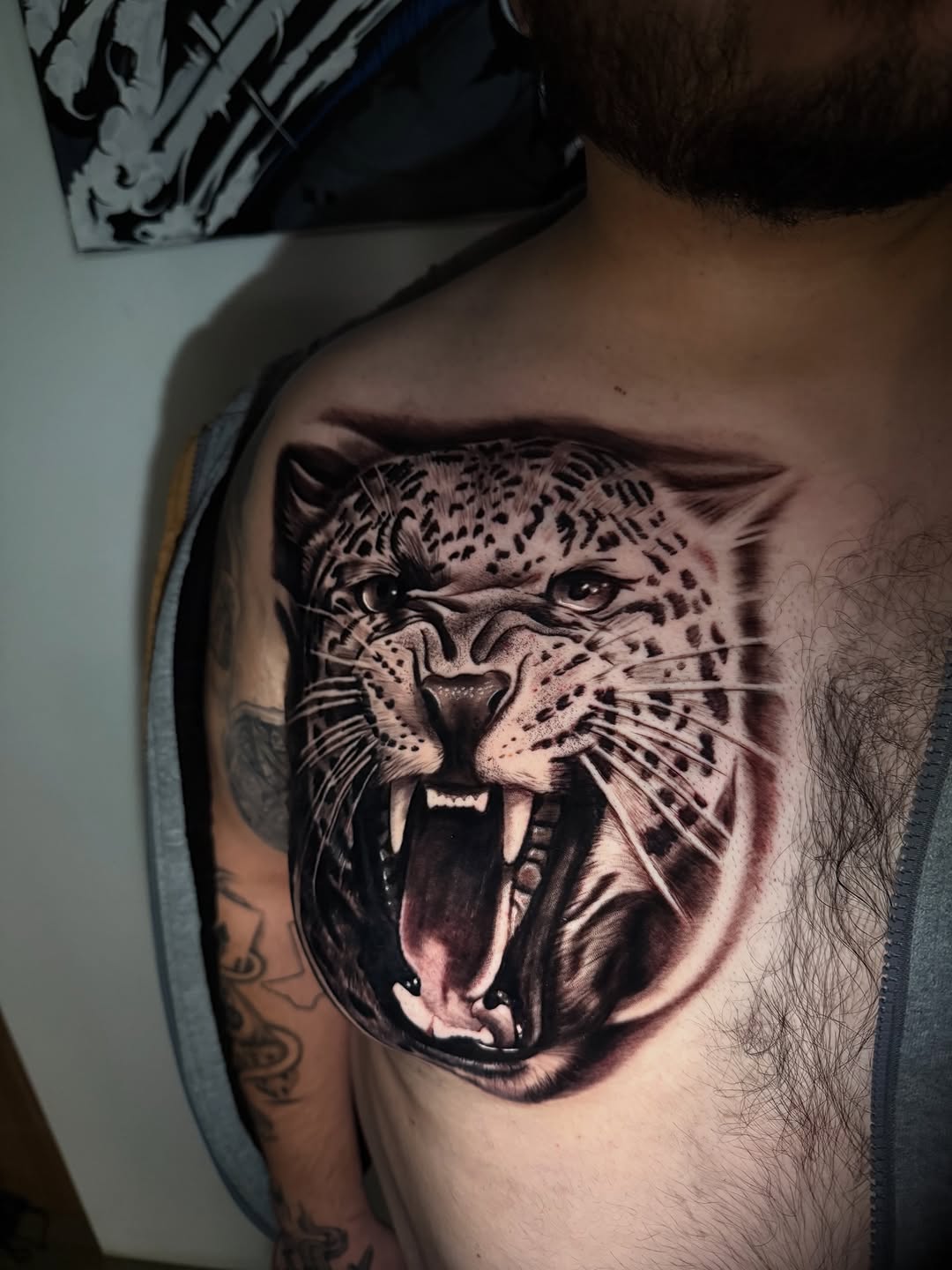Leopard face realism tattoo on the chest by inkzombi