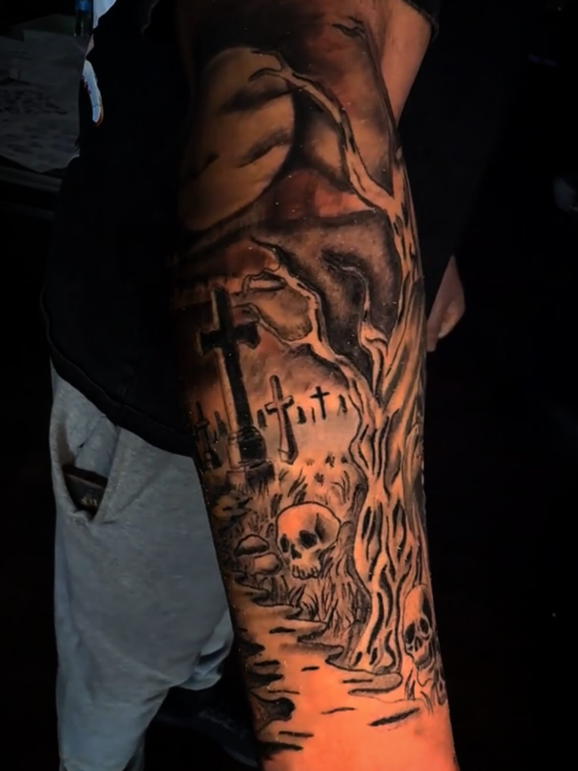 Graveyard scene dark realism tattoo on the forearm by LeLe