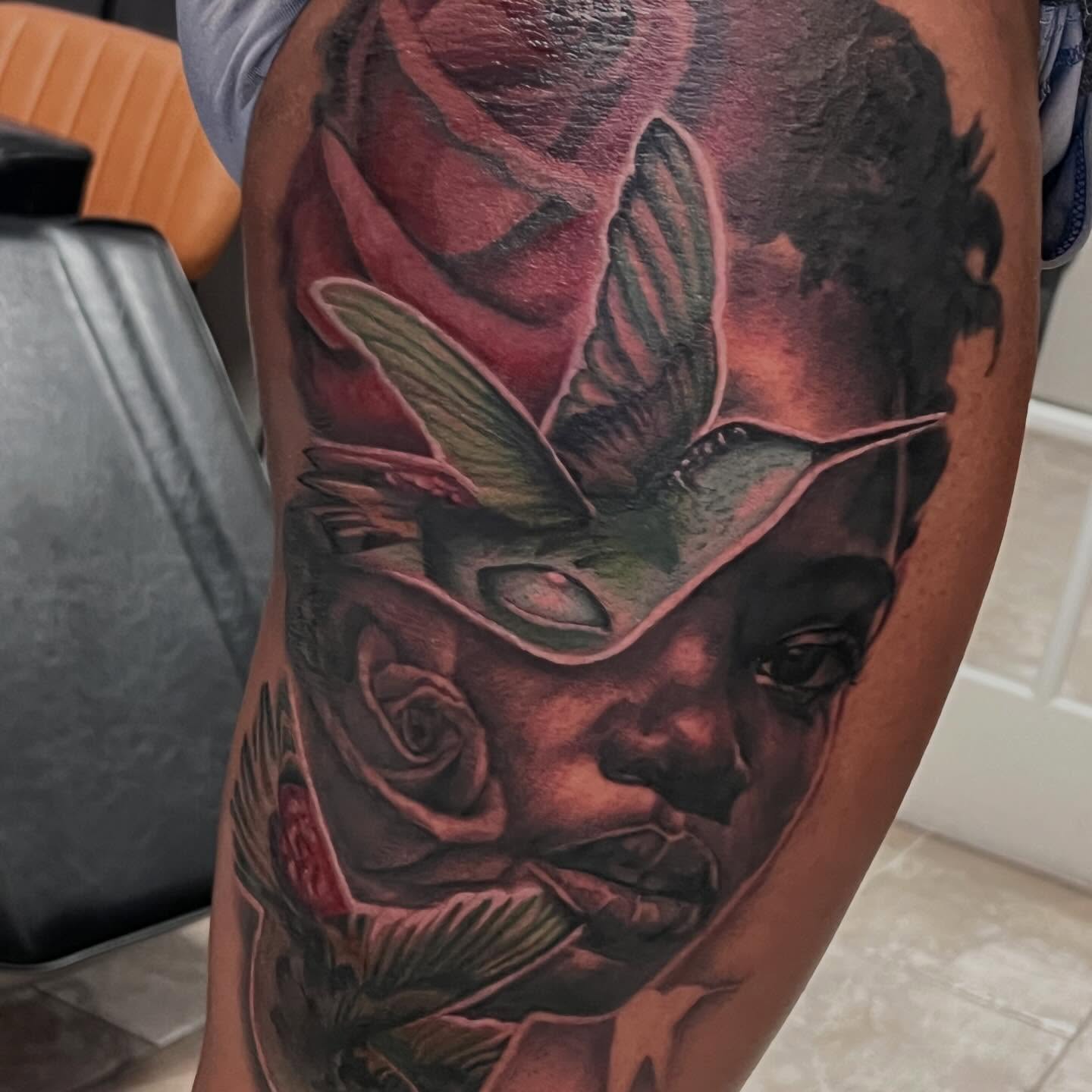 Mask and rose realism tattoo on the forearm by Tyler Cromwell