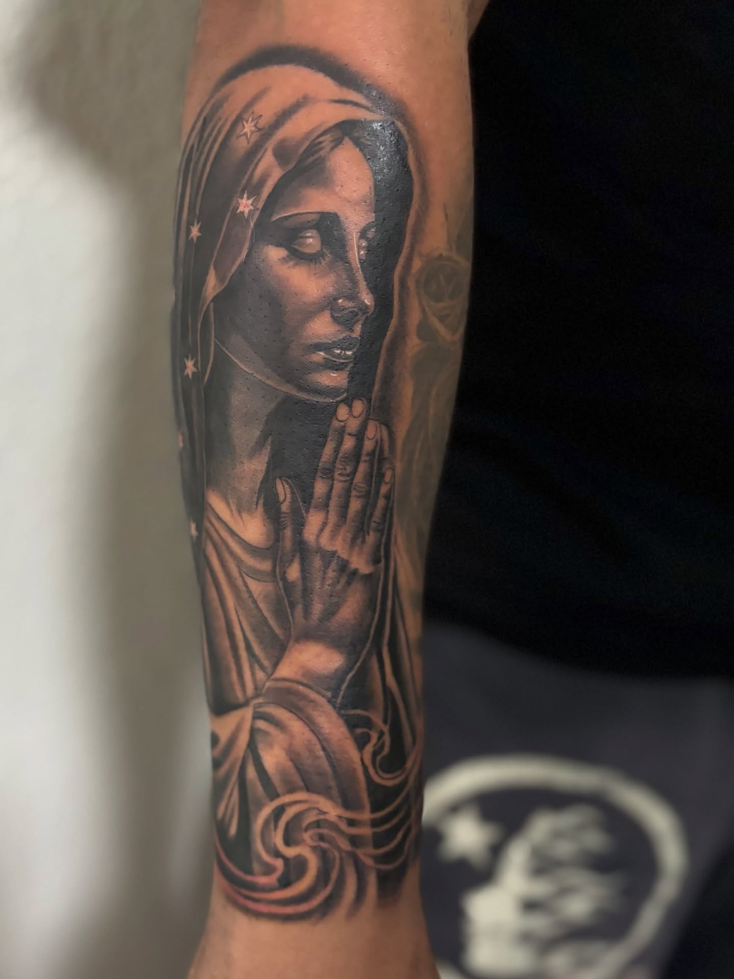 Praying woman realism tattoo on the forearm by @tattoosbyadrian