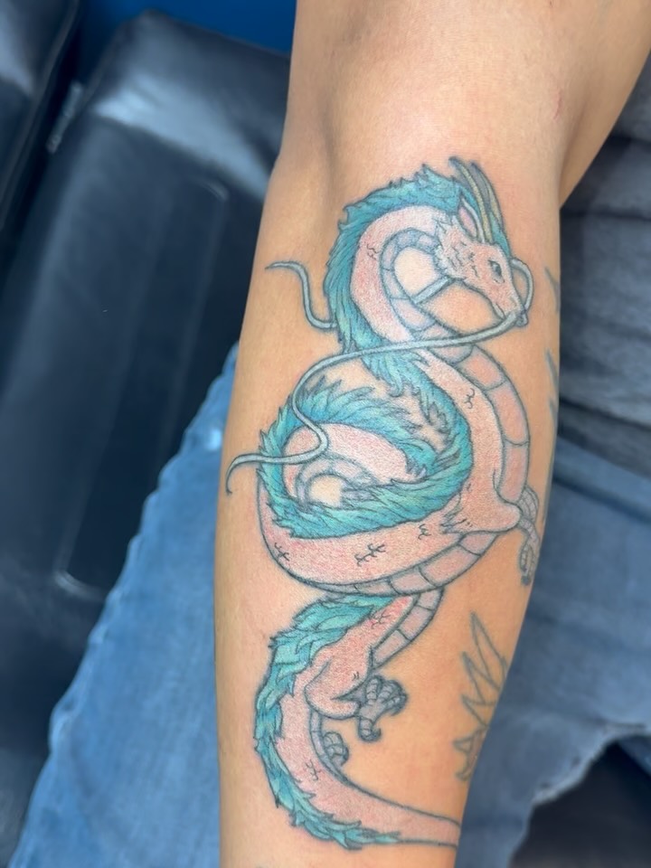 Dragon new school tattoo on the forearm by Elena