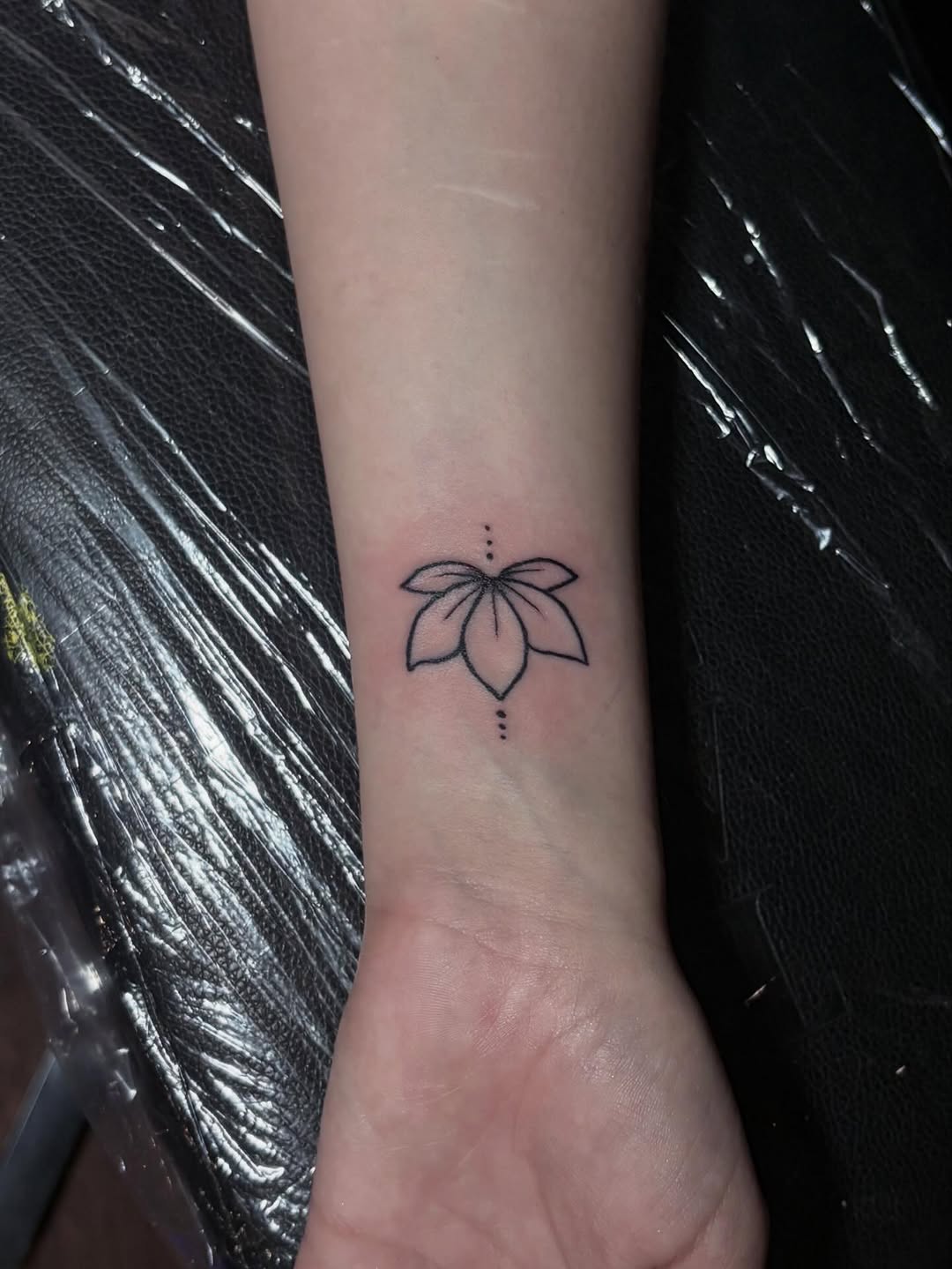 Lotus flower ornamental tattoo on the forearm by Angel Arceo