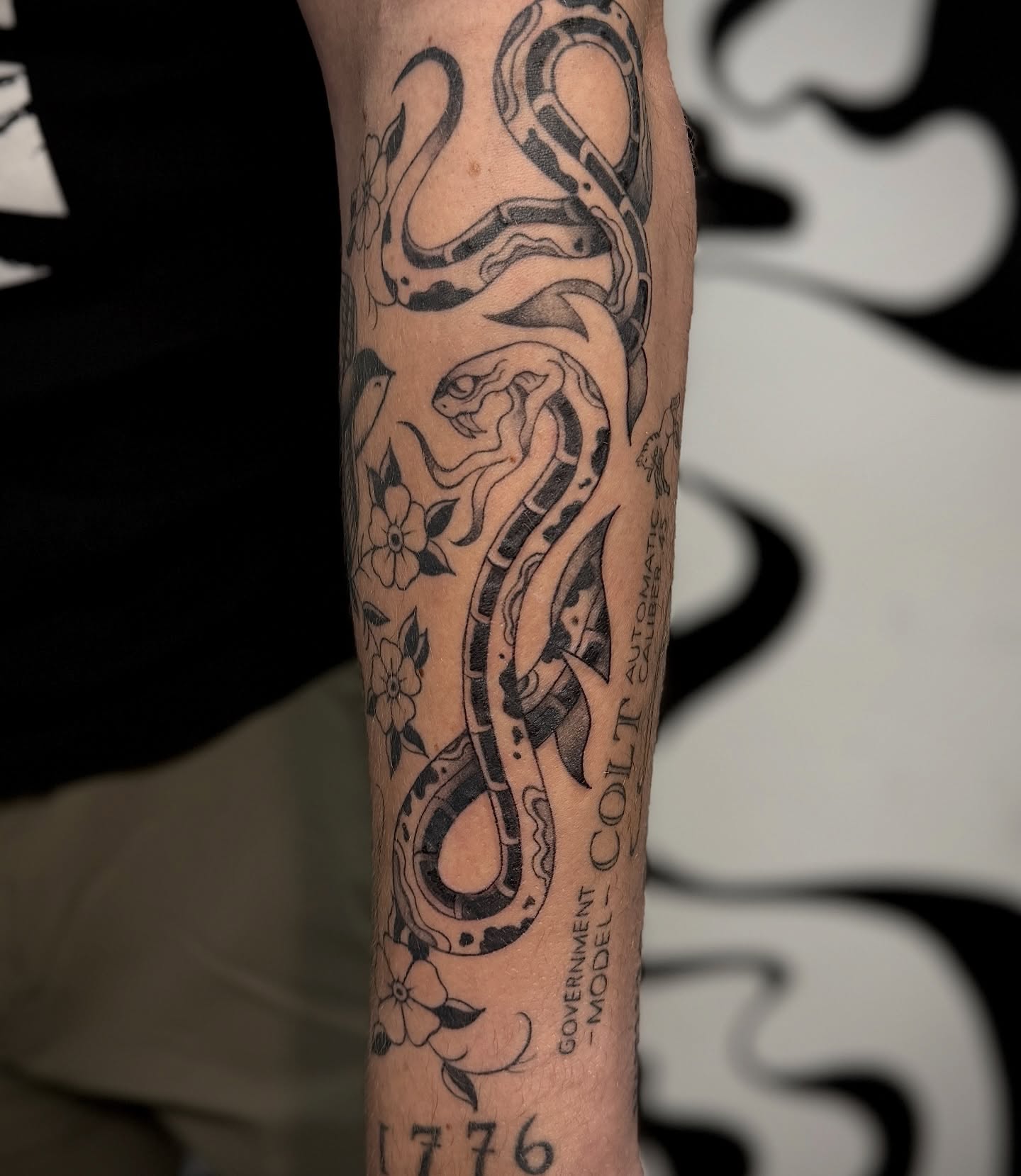 Snake black and grey tattoo on the forearm by 𝐀𝐝𝐫𝐢𝐞𝐥 𝐓𝐢𝐧𝐤𝐥𝐞𝐧𝐛𝐞𝐫𝐠 ⏾, Denison, Iowa