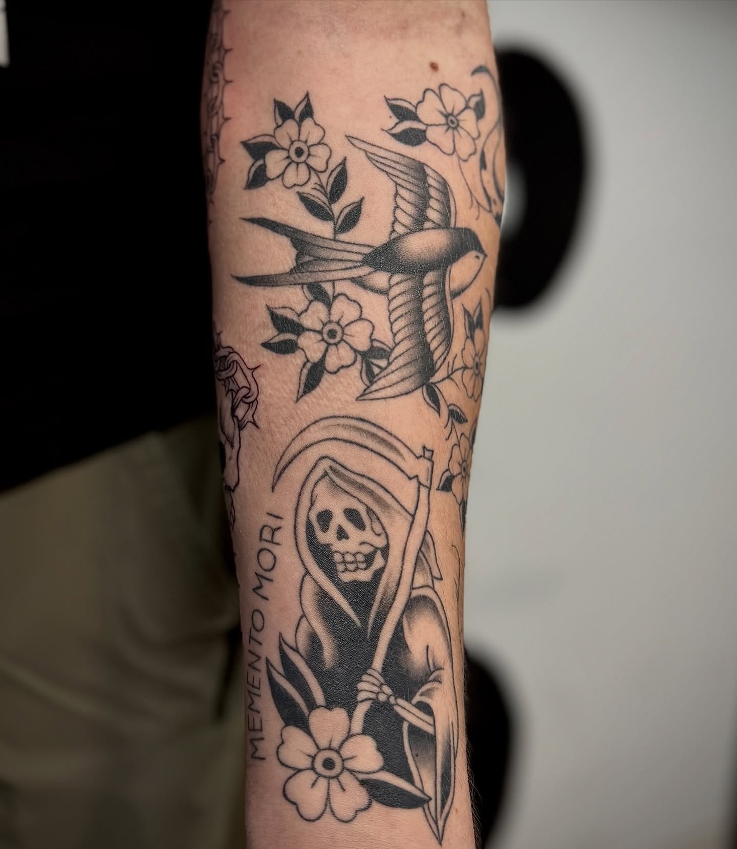 Death and flowers American traditional tattoo on the forearm by 𝐀𝐝𝐫𝐢𝐞𝐥 𝐓𝐢𝐧𝐤𝐥𝐞𝐧𝐛𝐞𝐫𝐠 ⏾, Denison, Iowa