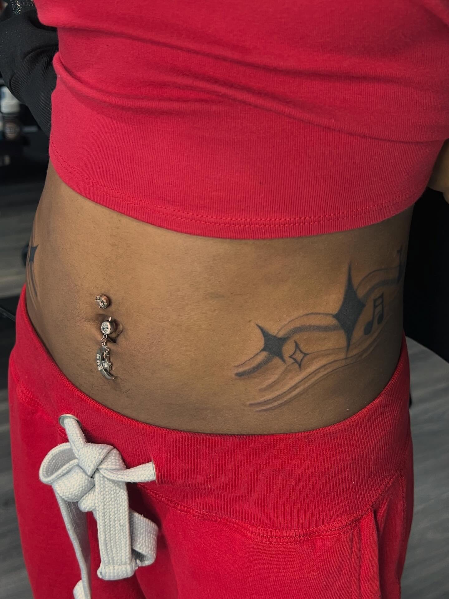 Music notes and stars black and grey tattoo on the torso by Haiiitattoo