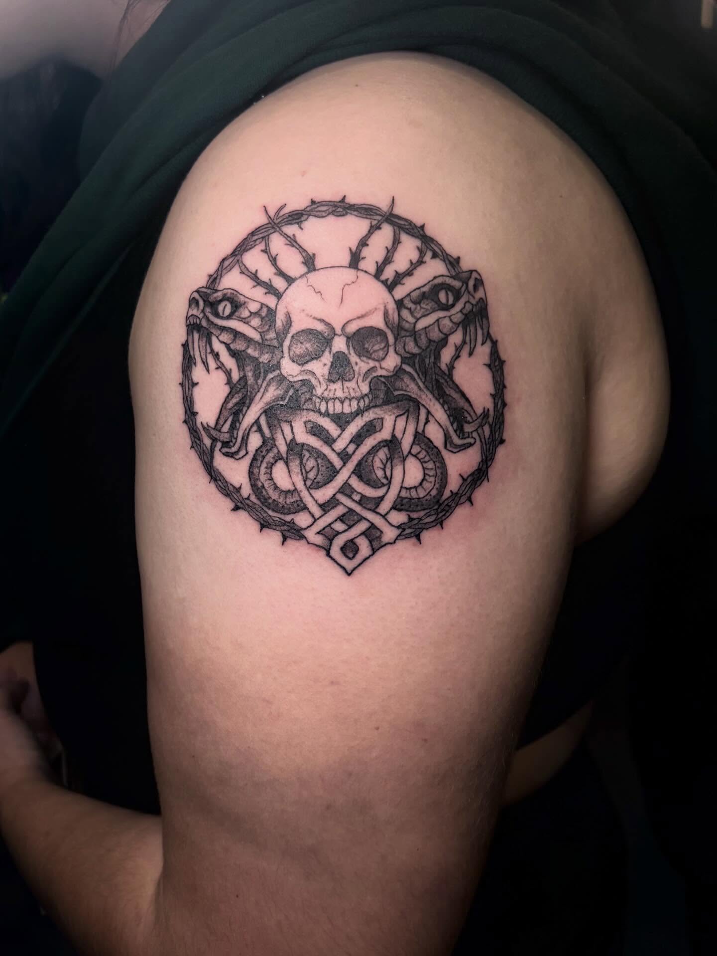 Skull and dragons geometric tattoo on the shoulder by Shampooh