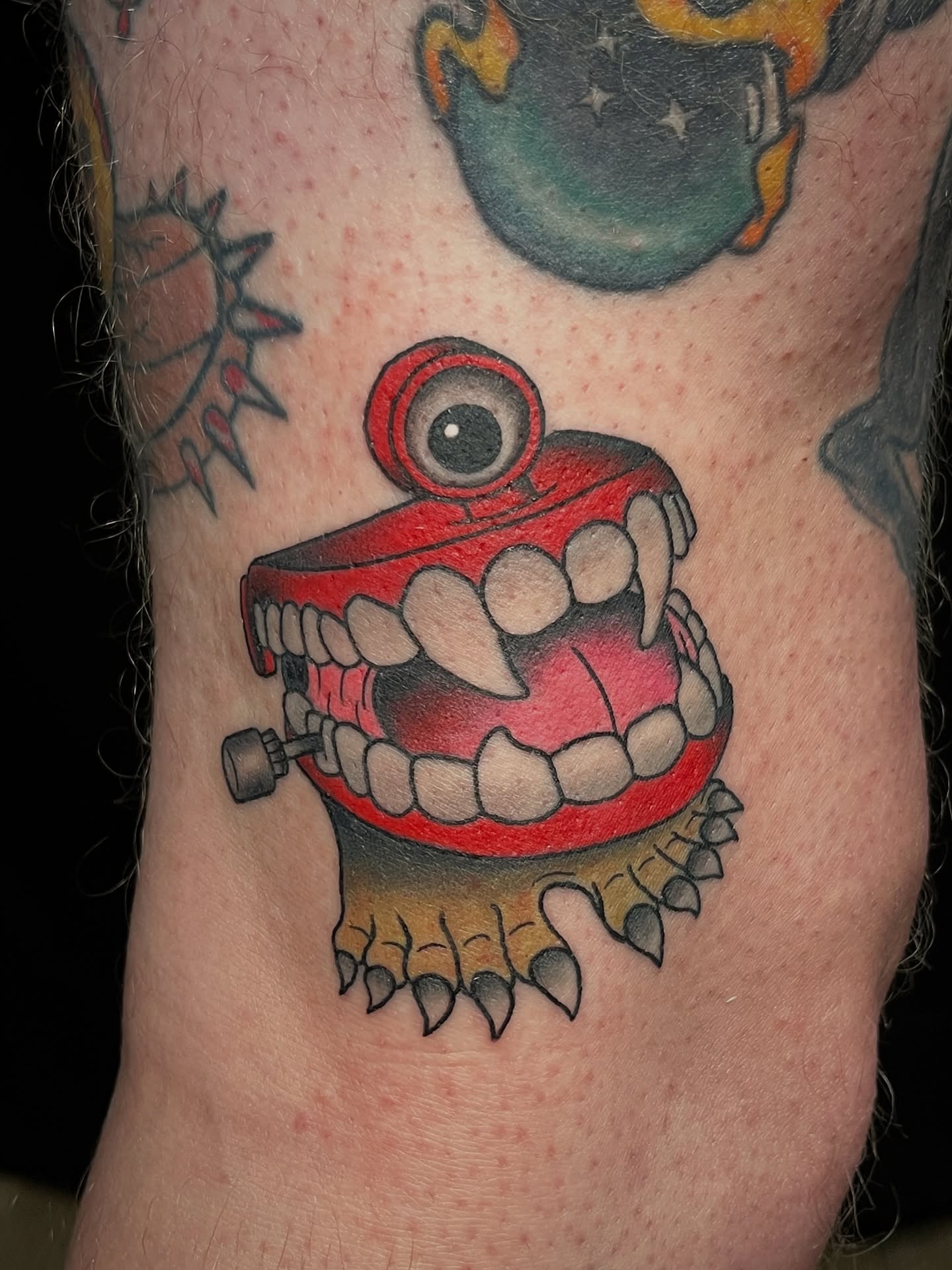 Chomping mouth American traditional tattoo on the forearm by Kyle Schneider