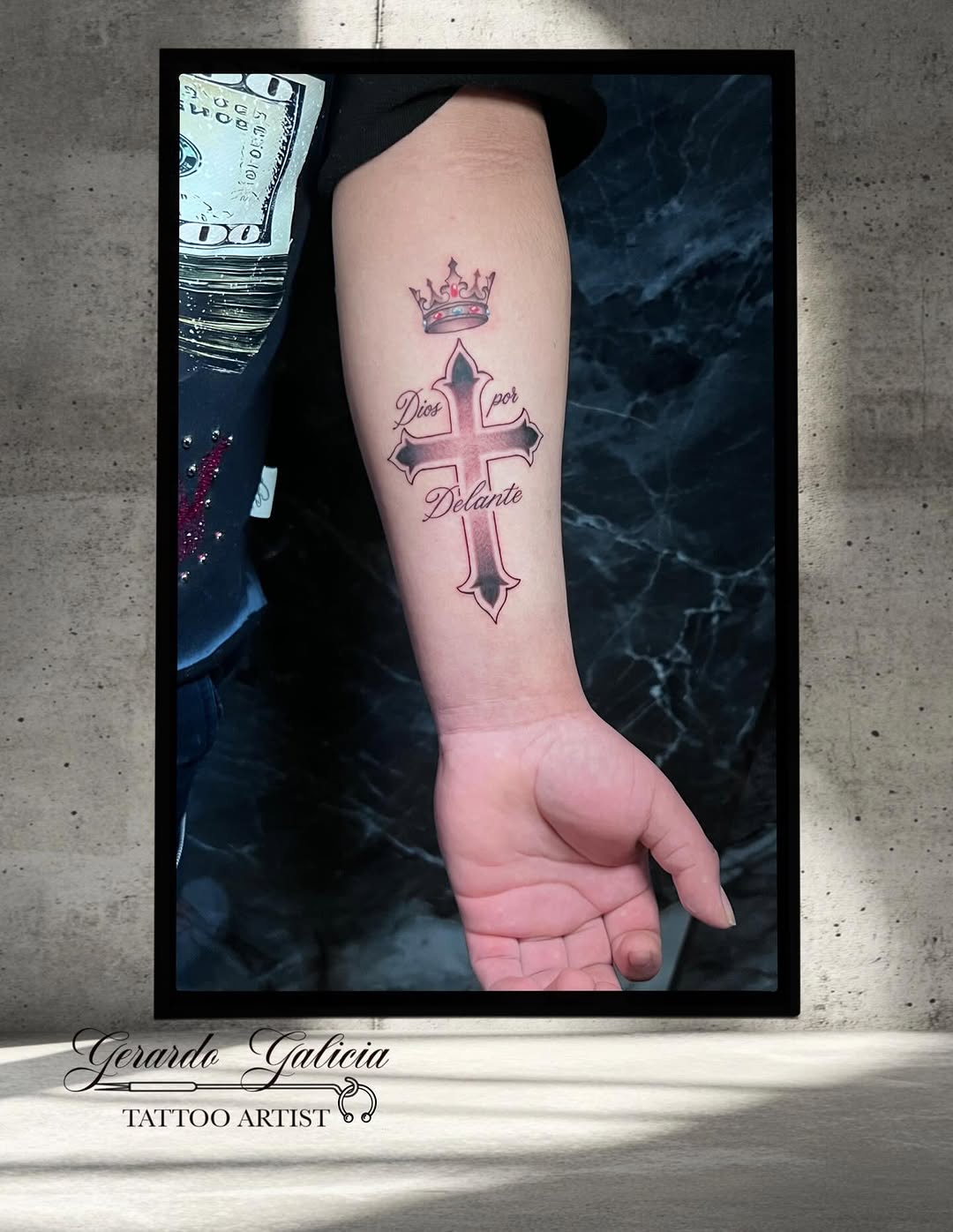 Cross with crown and lettering lettering tattoo on the forearm by Gerardo Galicia, New York, New York