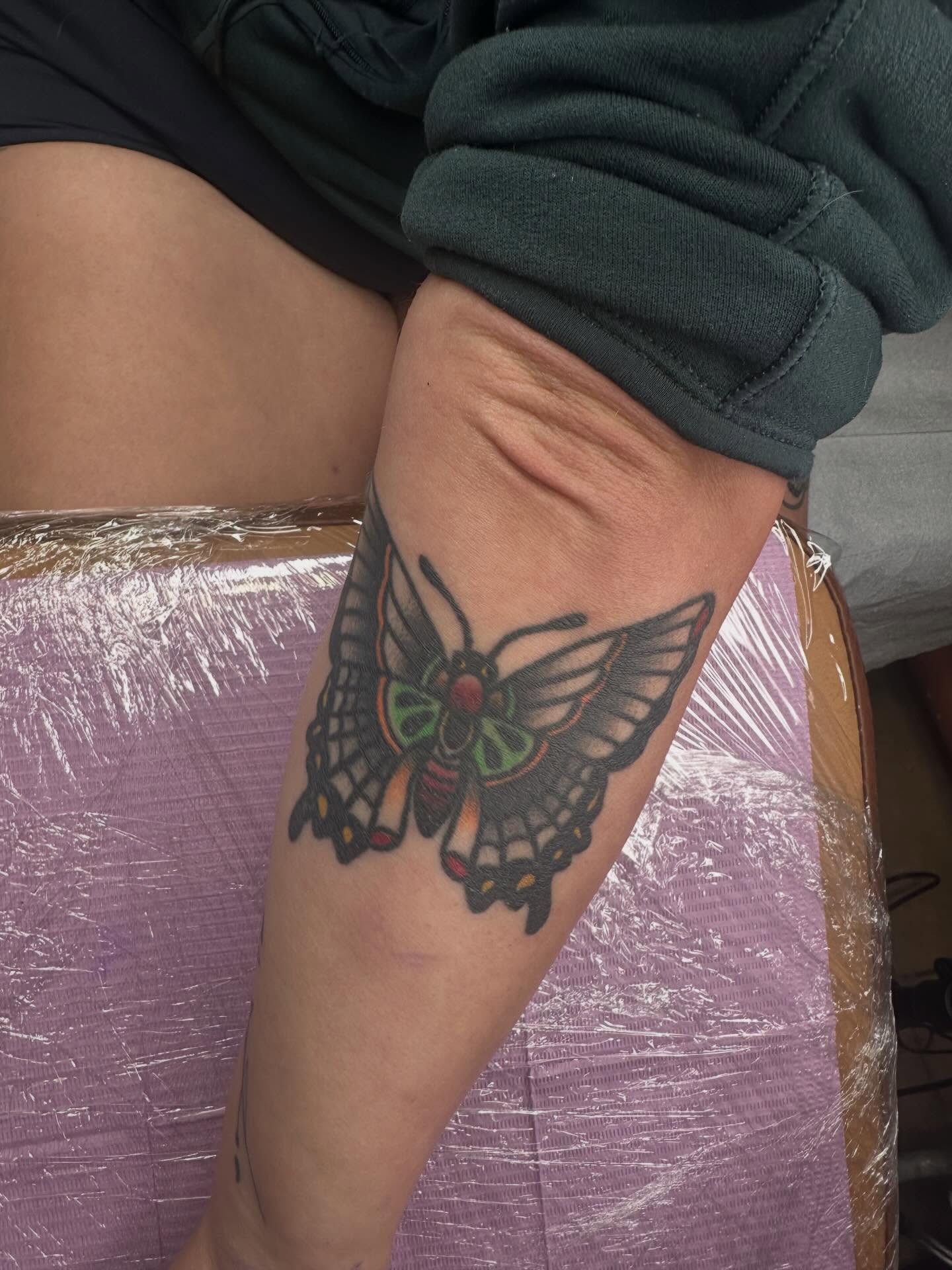 Butterfly American traditional tattoo on the thigh by Alex Gunshefski