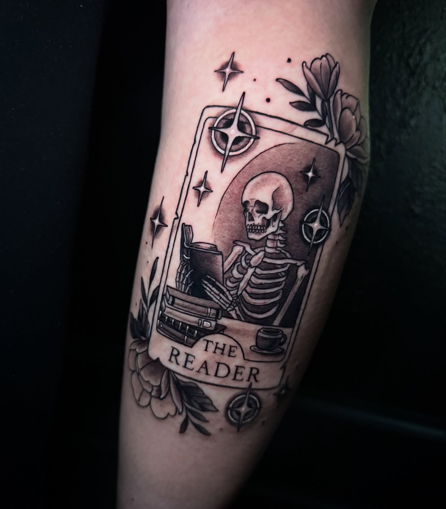 The reader tarot card black and grey tattoo on the forearm by Dee Florian