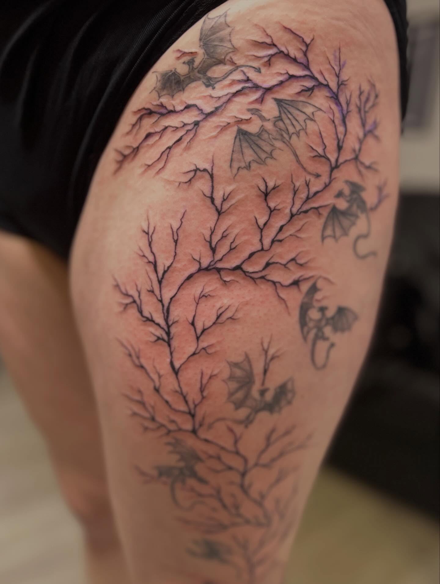 Tree branches black and grey tattoo on the thigh by Jbtattoo Artistry
