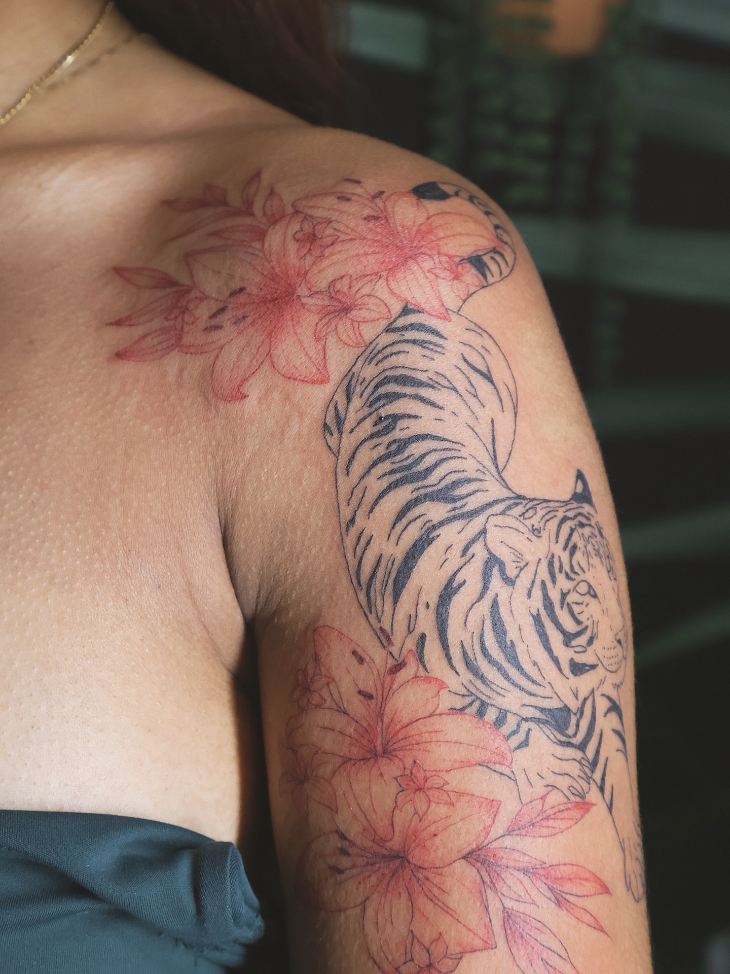 Tiger and flowers American traditional tattoo on the shoulder by 𝑭𝒊𝒏𝒆 𝑳𝒊𝒏𝒆 𝑻𝒂𝒕𝒕𝒐𝒐’𝒔