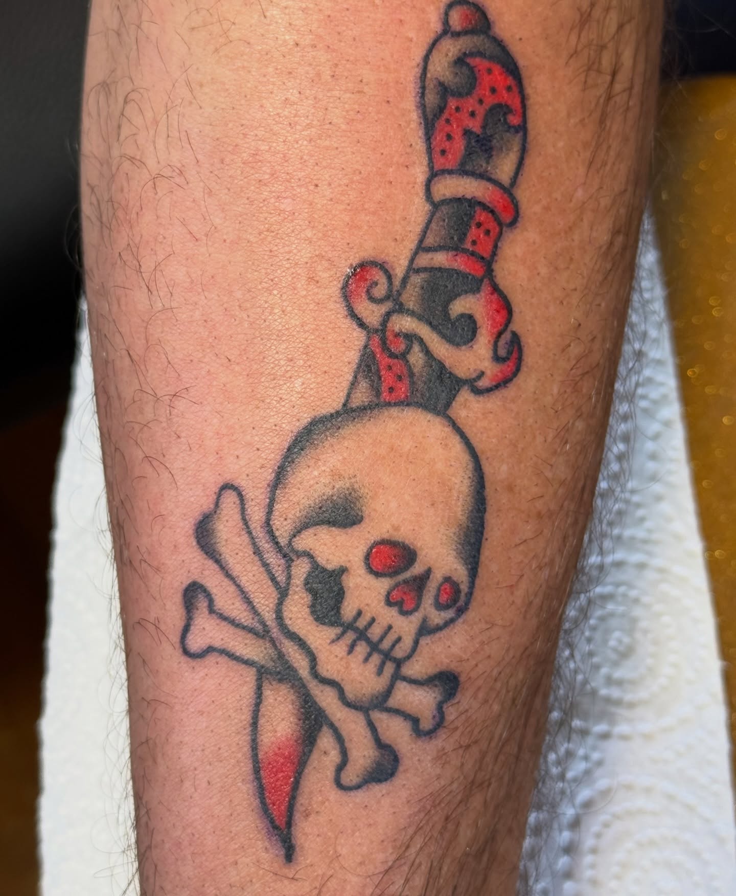 Skull and dagger American traditional tattoo on the forearm by Bronzino Ink - Karen, Asheville, North Carolina
