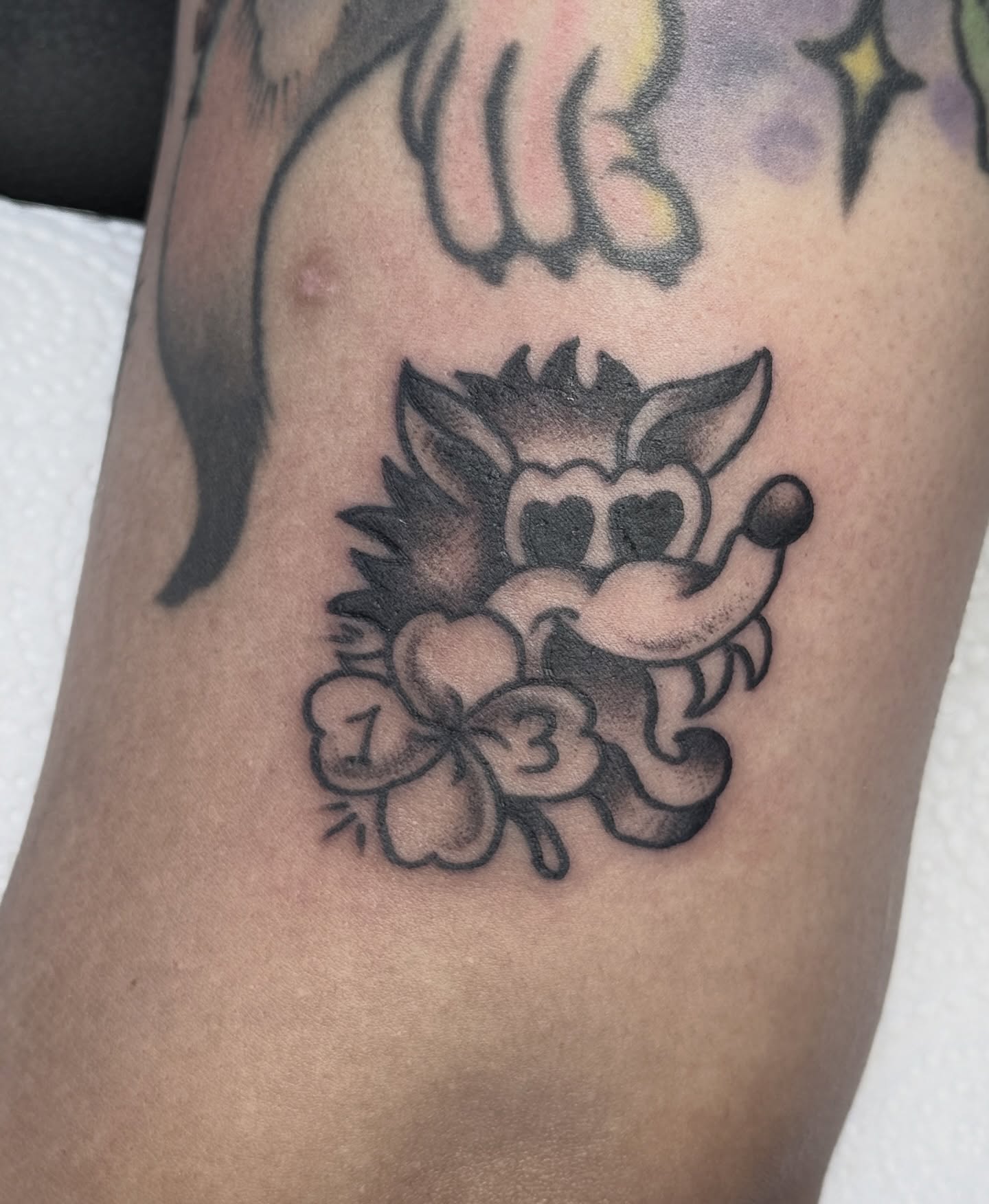 Flower and skull black and grey tattoo on the thigh by Bronzino Ink - Karen, Asheville, North Carolina