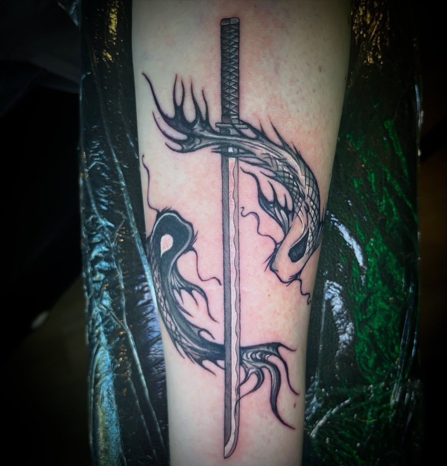 Dragon and sword realism tattoo on the forearm by Kiwi🌱☀️