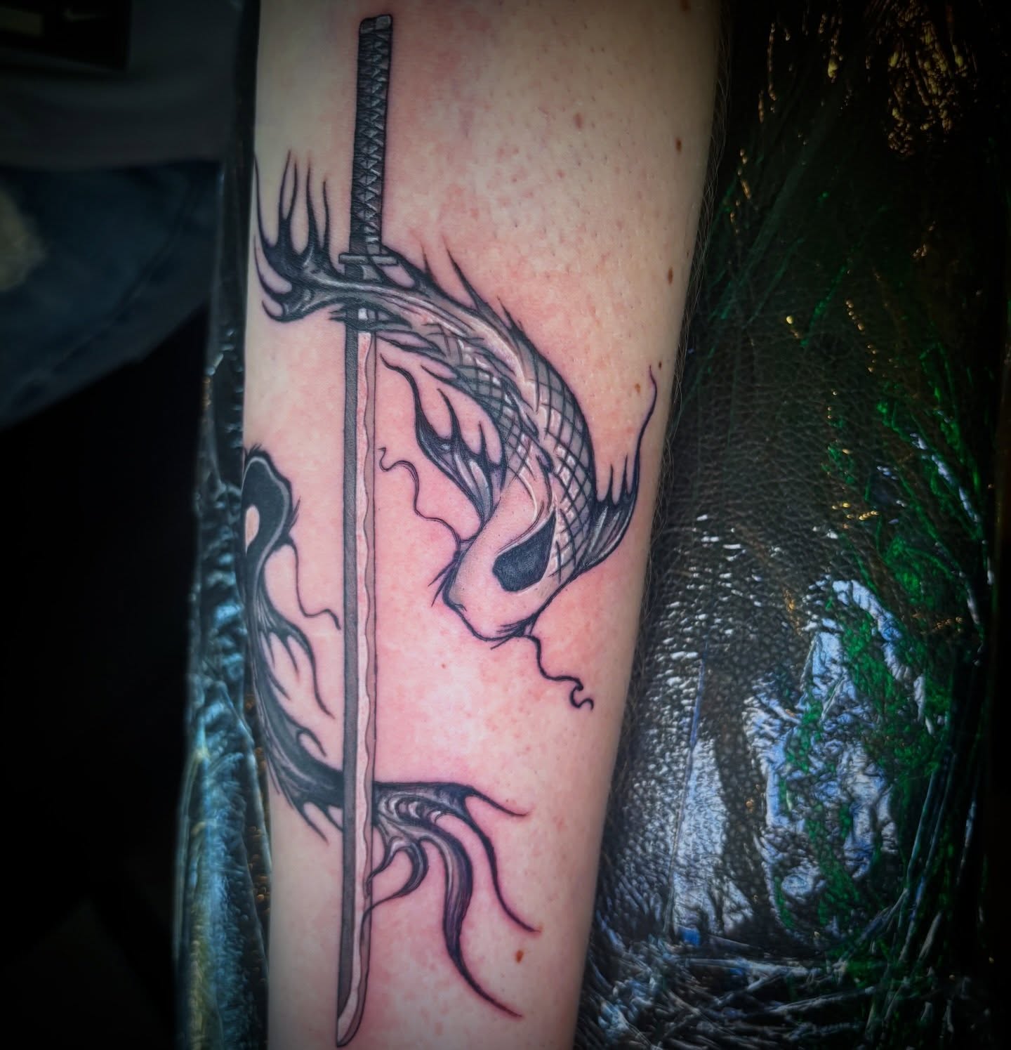 Dragon and sword realism tattoo on the forearm by Kiwi🌱☀️