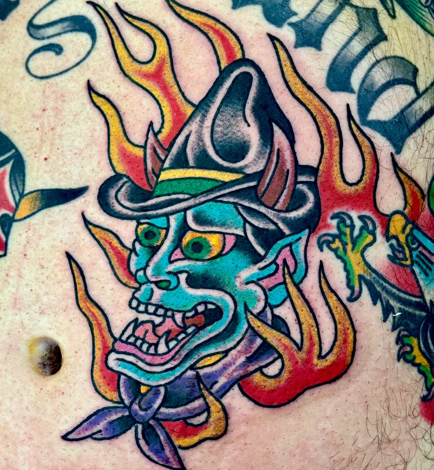 Demon mask American traditional tattoo on the chest by Sam Hambrick, Watchung NJ