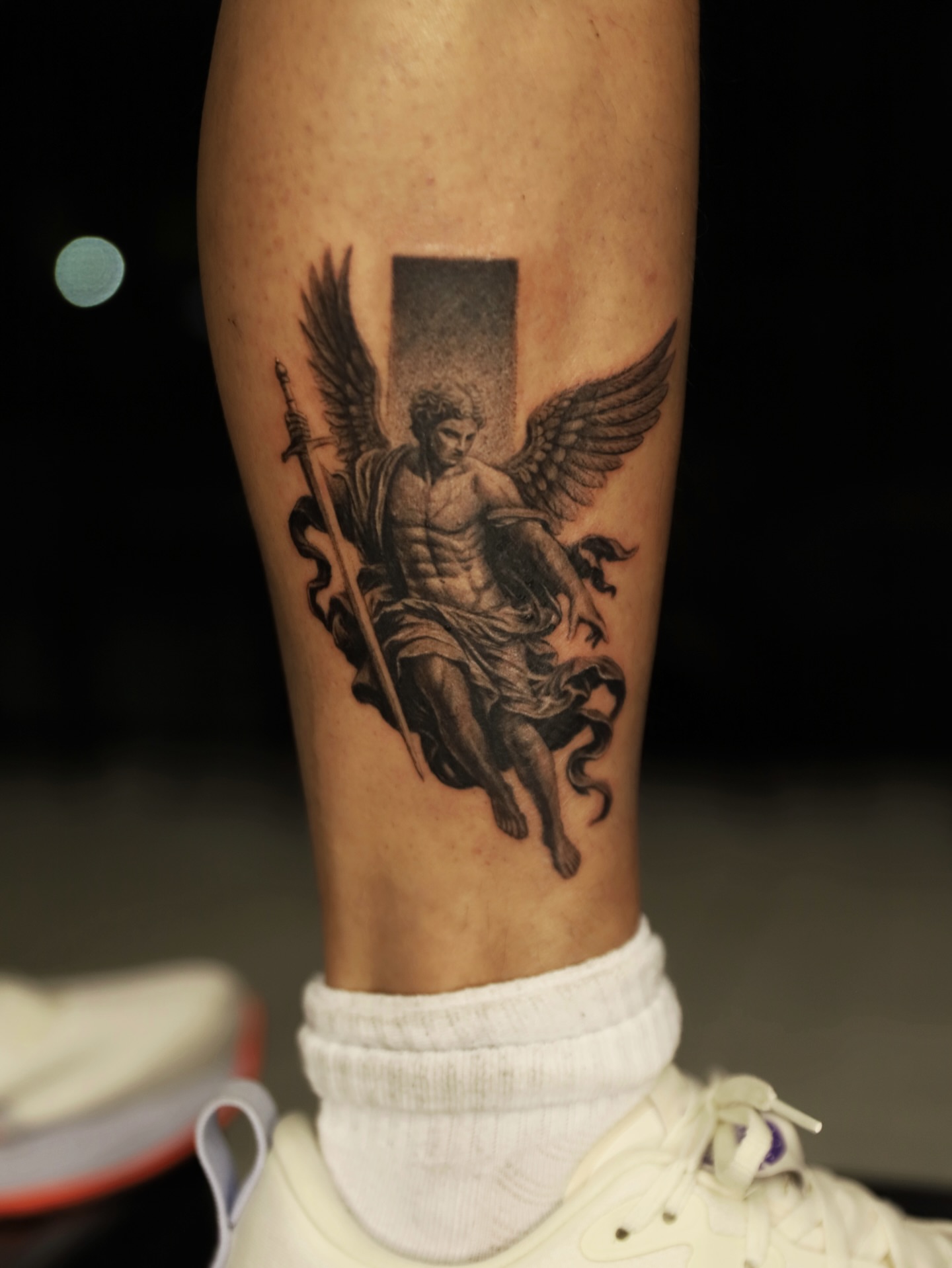 Angel with sword black and grey tattoo on the forearm by Las Vegas tattoo