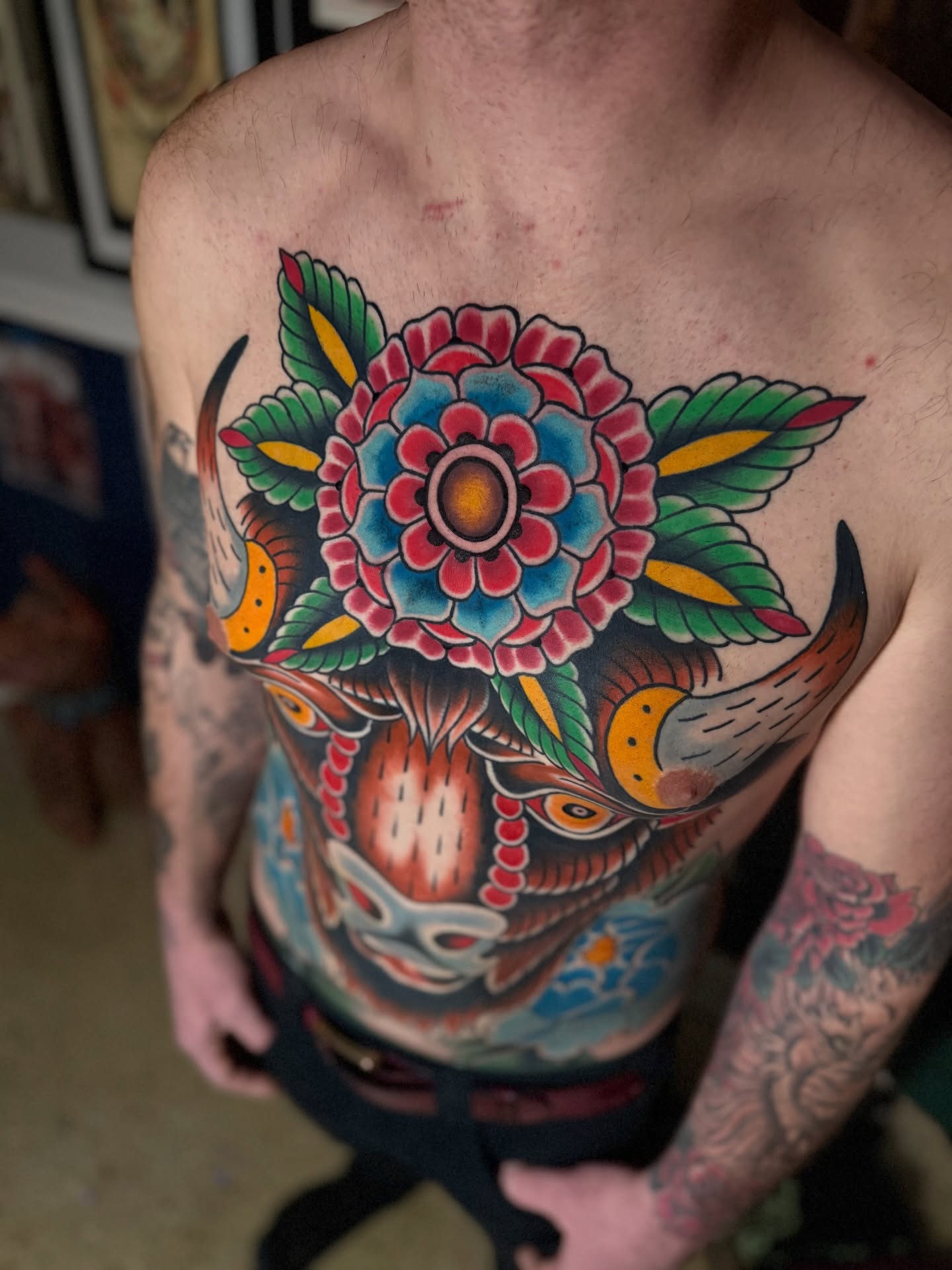 Flower and mask American traditional tattoo on the chest by Jhon