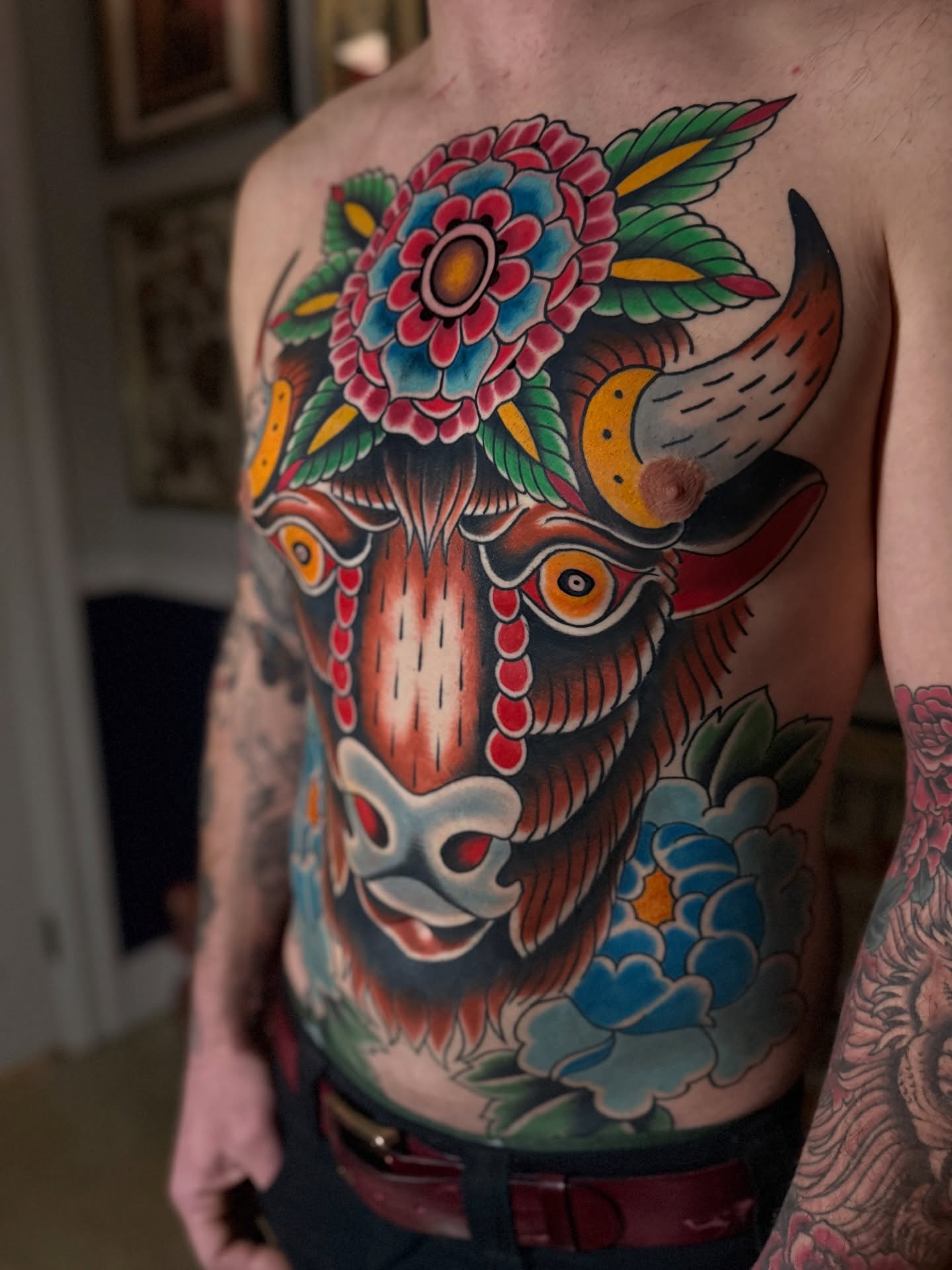 Bull and floral American traditional tattoo on the chest by Jhon