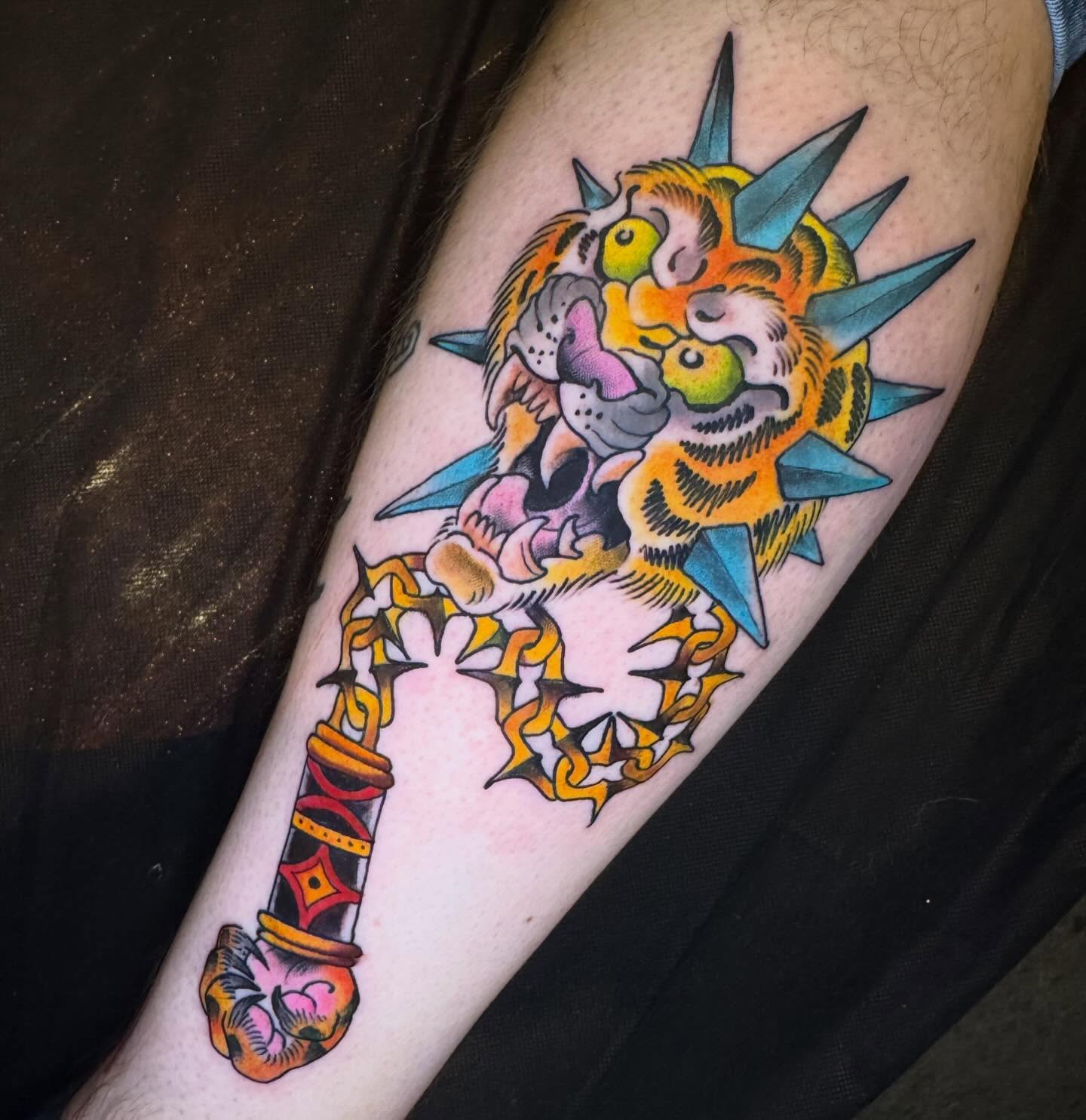 Tiger and dagger American traditional tattoo on the forearm by Mike Bean, Minneapolis, Minnesota