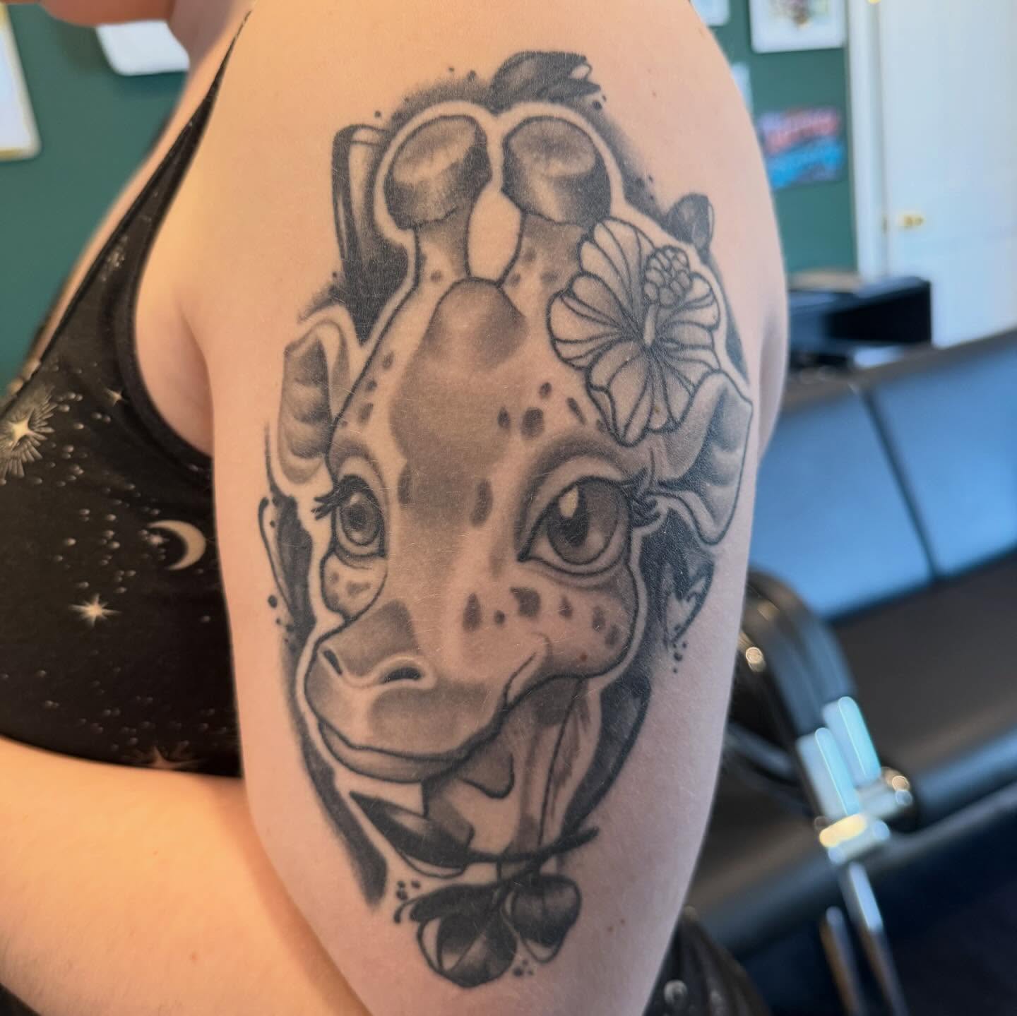 Giraffe black and grey tattoo on the forearm by Matthew Gordon