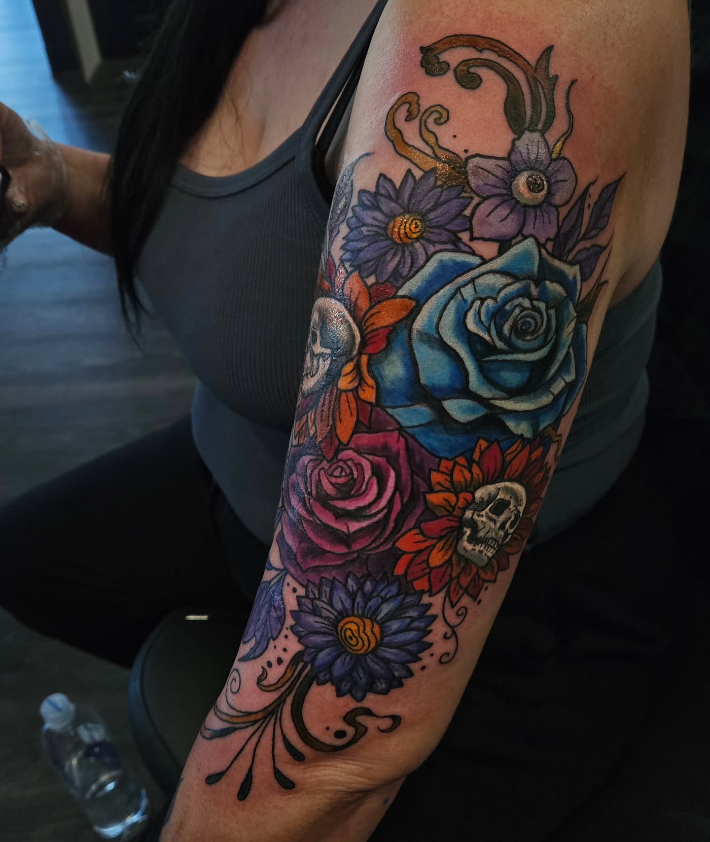 Floral bouquet with skulls American traditional tattoo on the forearm by Angie Griffith 🥰, Glendale, Arizona