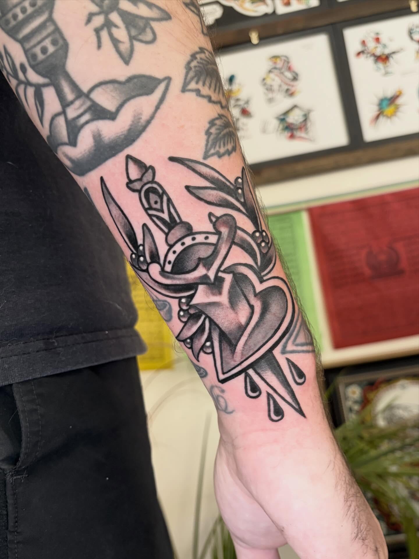 Heart with dagger American traditional tattoo on the forearm by ๐ป๐๐๐ ๐ณ๐๐๐๐๐๐ ๐๐๐