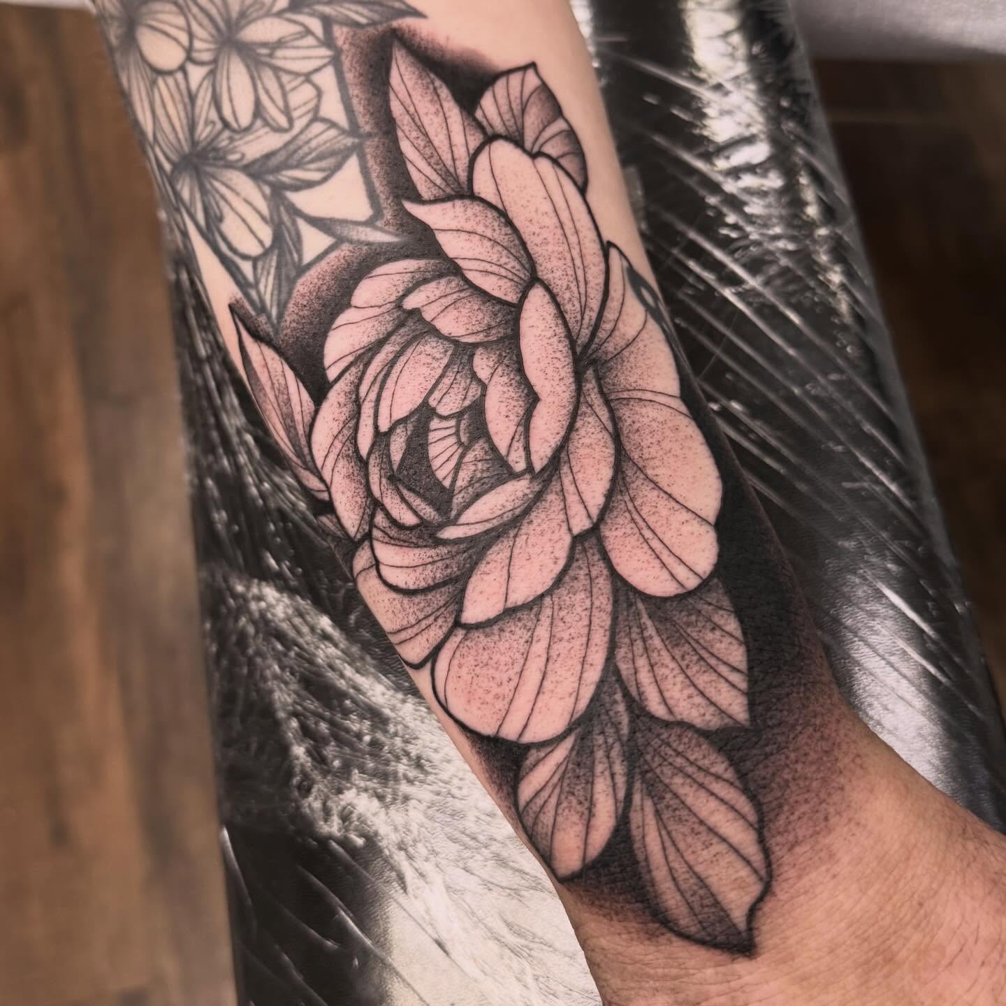 Rose dotwork tattoo on the forearm by Sarah Foltz