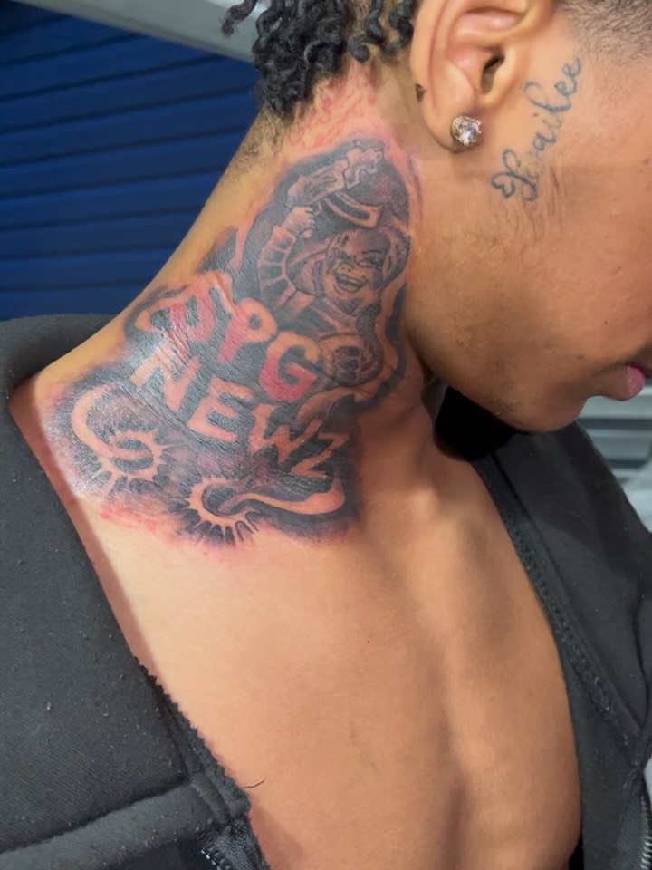 Character with text realism tattoo on the neck by Deangelo Inkcrazy Dukes